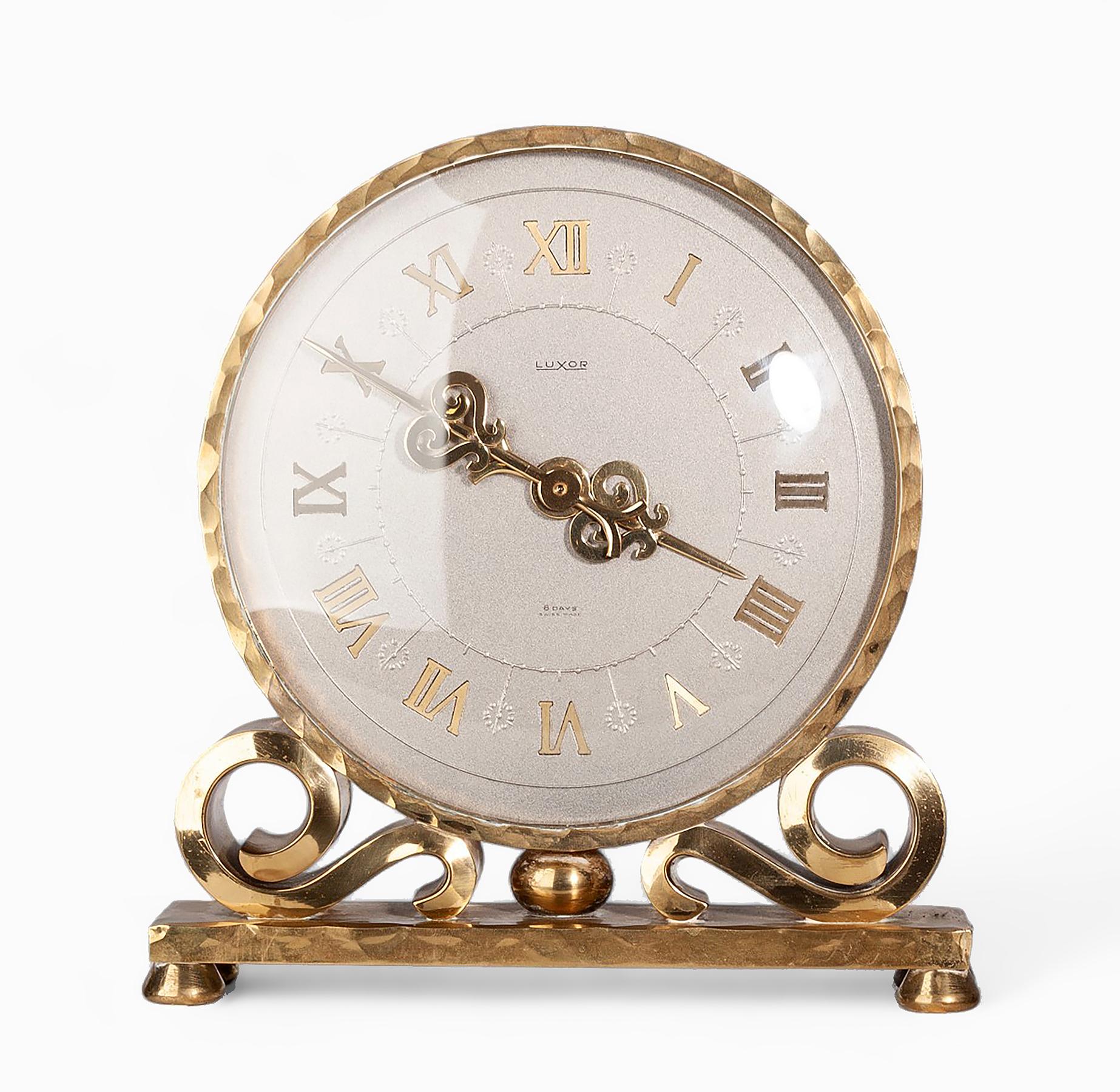 1950s Mid-Century Modern gilt bronze/ormolu 8-days movement mantel clock by Luxor, Switzerland

By: Luxor
Material: bronze, copper, ormolu, metal, glass, crystal
Technique: cast, molded, metalwork, polished, gilt
Dimensions: 2 in x 7.5 in x