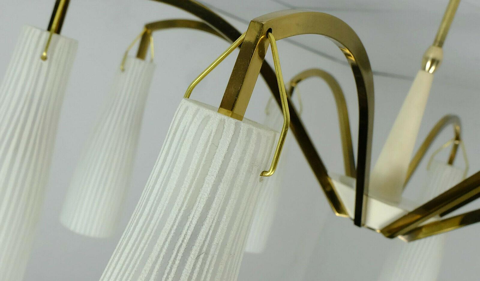 Fantastic large 1950s hanging lamp. Made of brass and beige lacquered metal. 8 shades made of white glass with fine stripes and rough surface. For 8 E14 bulbs (bulbs on the pictures are not included in the price).

Dimensions: diameter 27 1/2