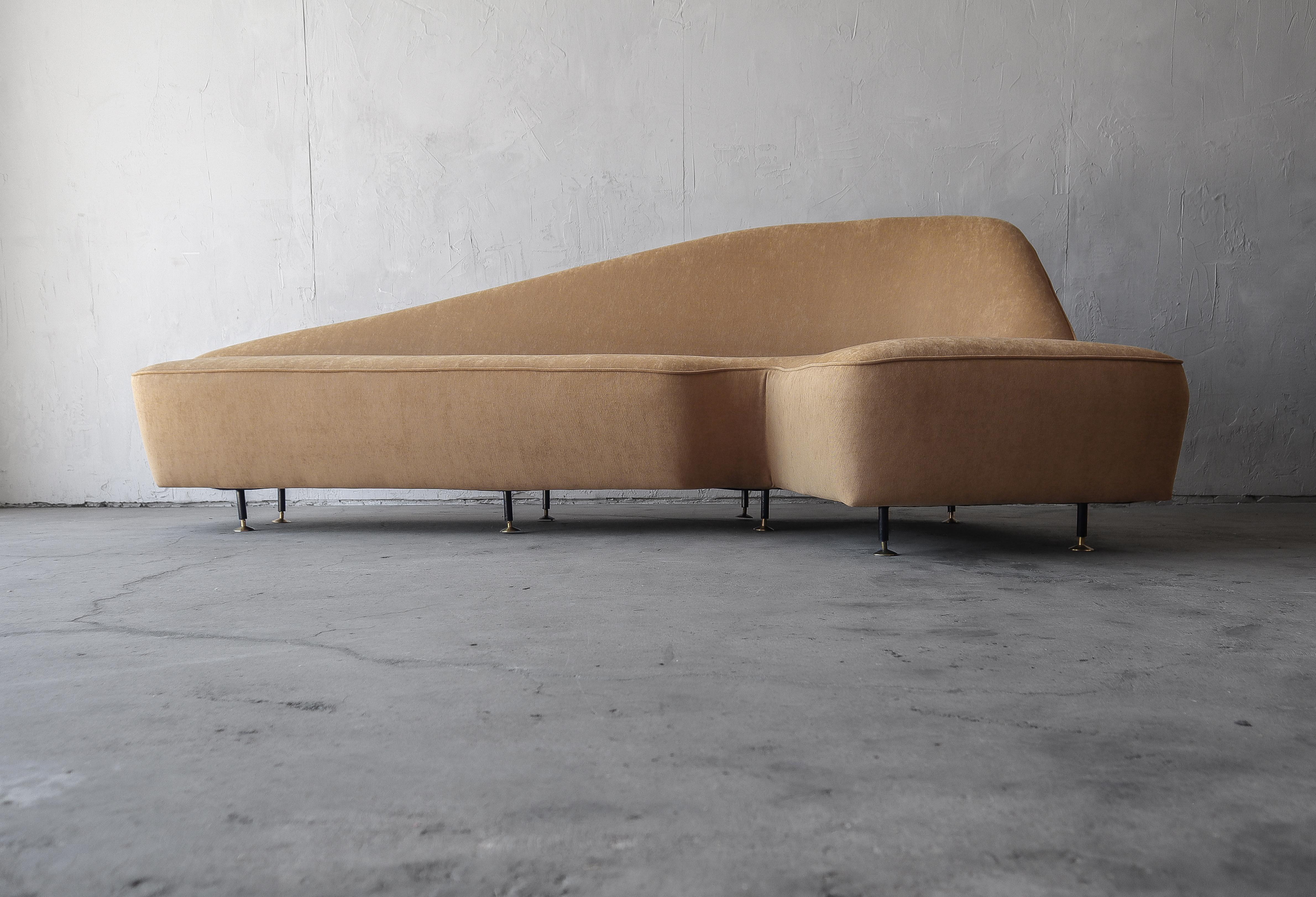 If elegance was a sofa, this would be the one.  This 1950's Italian sofa has all the right angles and curves in all the right places.

Check out the before and during restoration pictures.  This sofa has a completely steel frame, you rarely see this