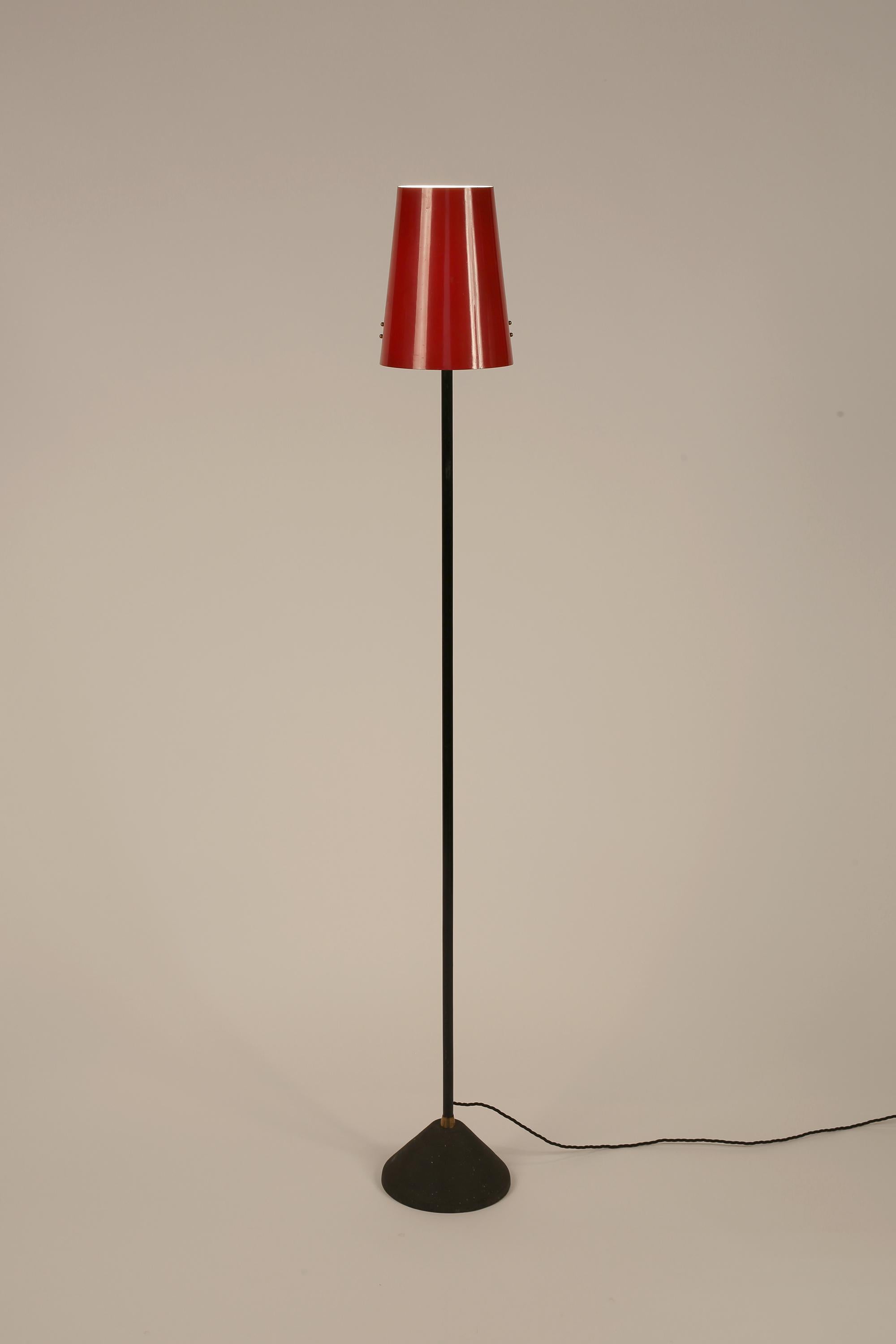 A fun, cast iron and steel floor lamp with original red enamelled steel shade. Unmarked but likely manufactured by Stilux - Milano. Italian, c. 1950s.