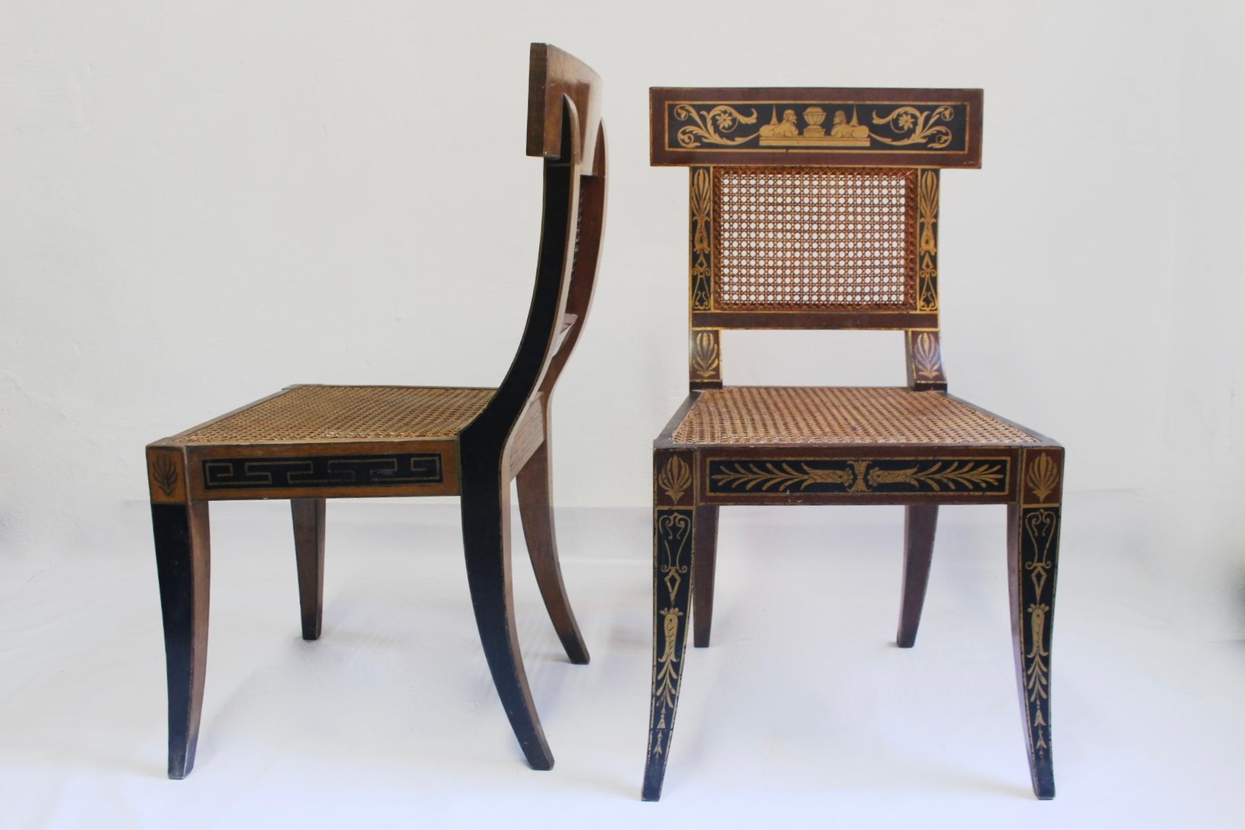 Impressive midcentury pair of Greek revival hand painted Klismos chair with caned back and seat, this ‘klismos’ form chair is painted with acanthus leaves other classical decorative motifs., made in EEUU in the 1950s in the manner of the Waln family