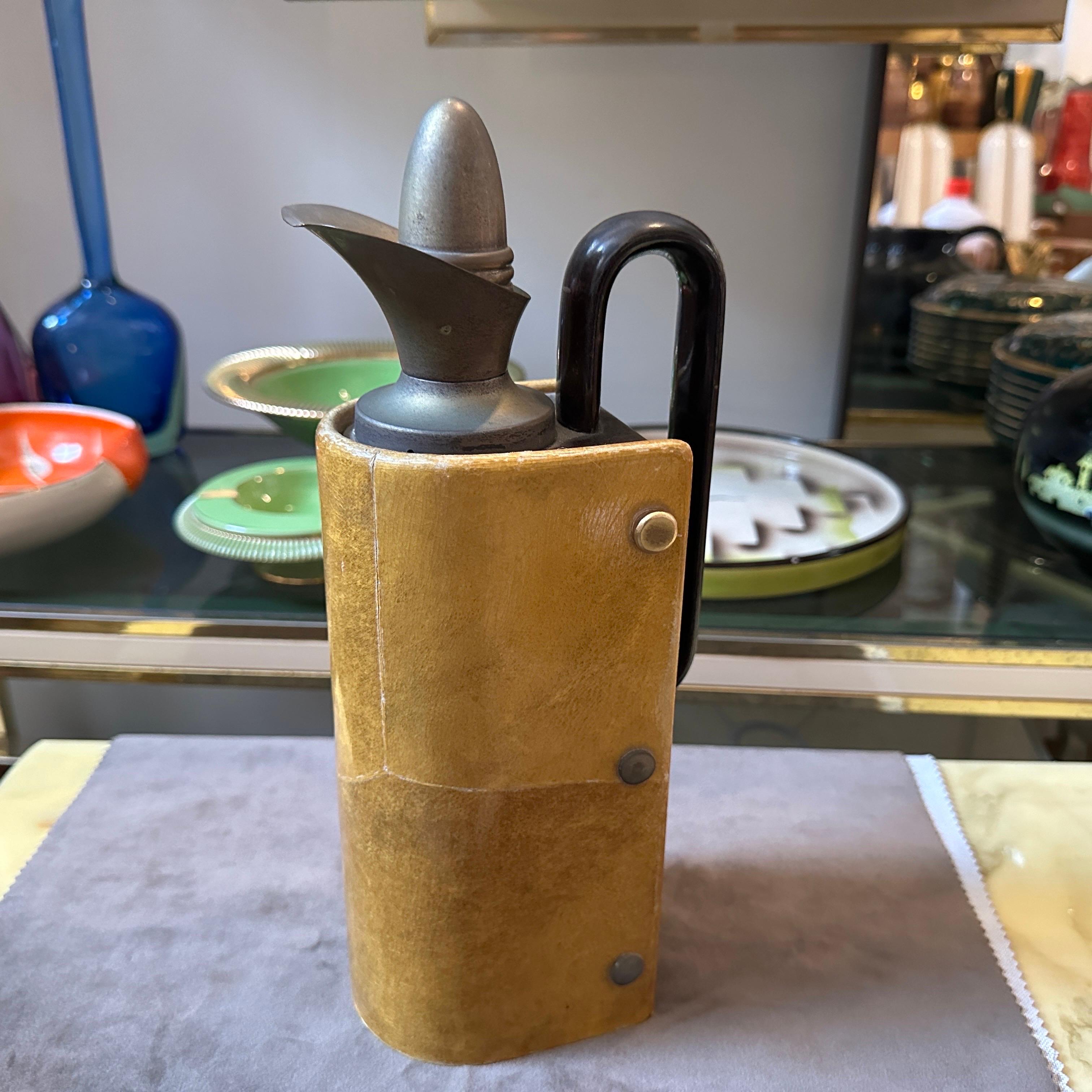 An amber goatskinn thermos carafe designed by Aldo Tura, it has been manufactured in Milano in the Fifties by Tura Creazioni, it's labeled on the bottom, it's in vintage conditions with signs of use and age visible on the photos. This carafe