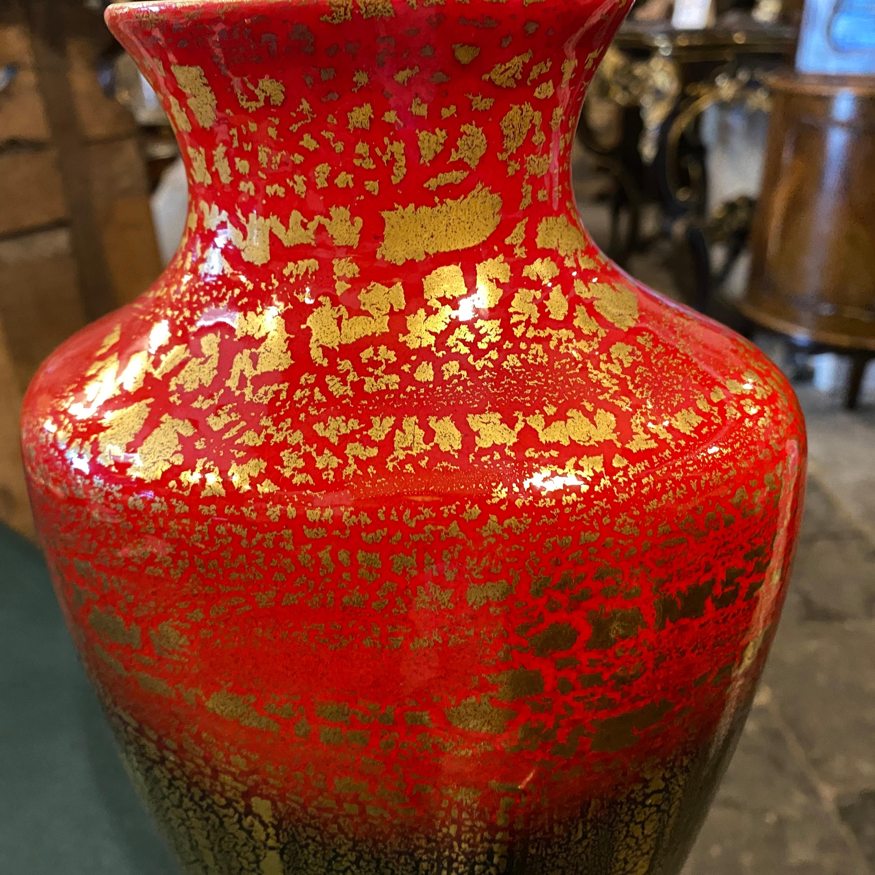 An hand-crafted red, black and gold ceramic vase made in Italy in the Fifties by La Donatella, a small manufacturer located in Northern Italy, it's in perfect conditions and signed on the bottom.