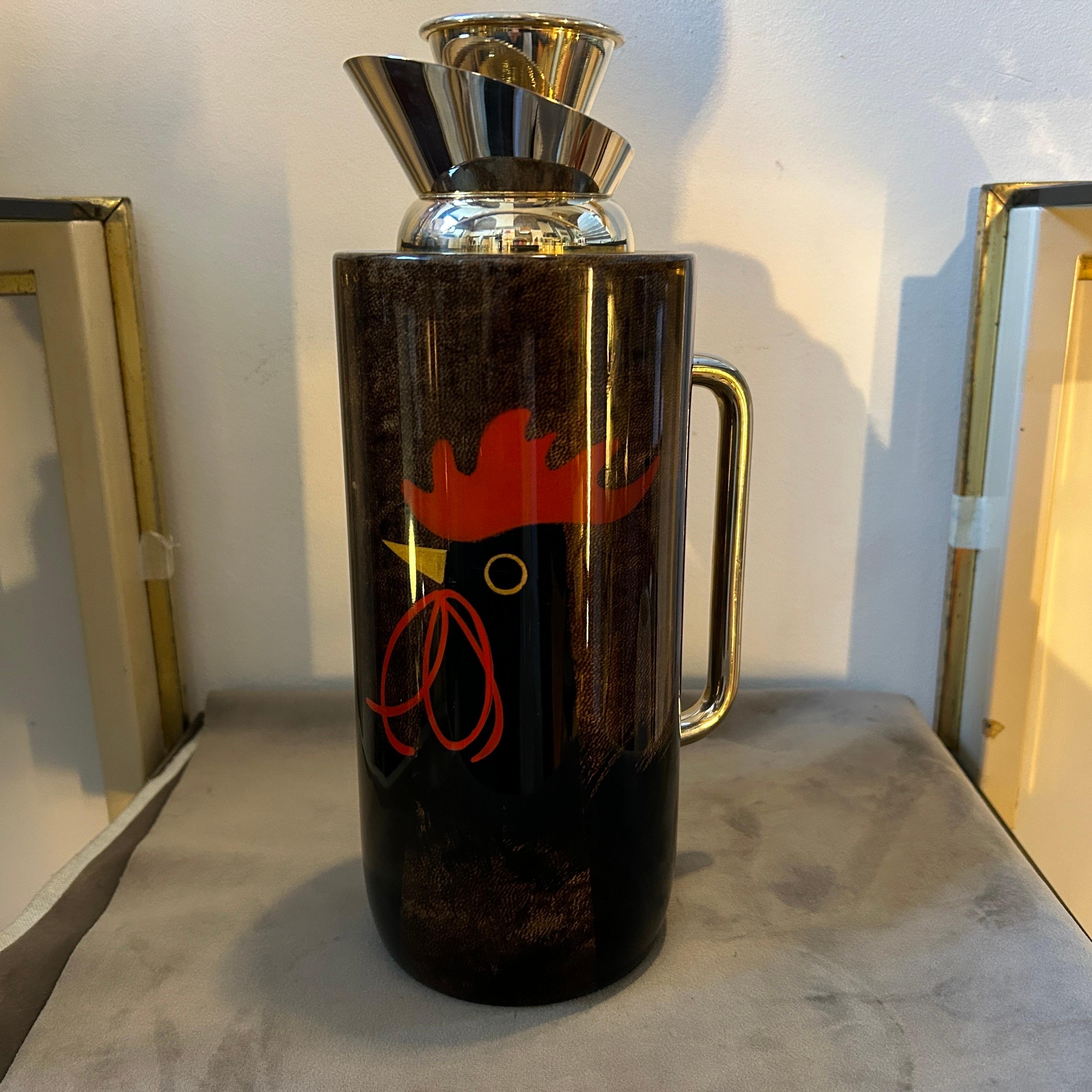 A 1950s Mid-Century Modern brass and brown Goatskin Thermos Carafe designed by Aldo Tura and manufactured by Tura Creazioni Milano, it's in lovely conditions, brown goatskin is decorated with a stylized polychrome rooster, brass it's in original