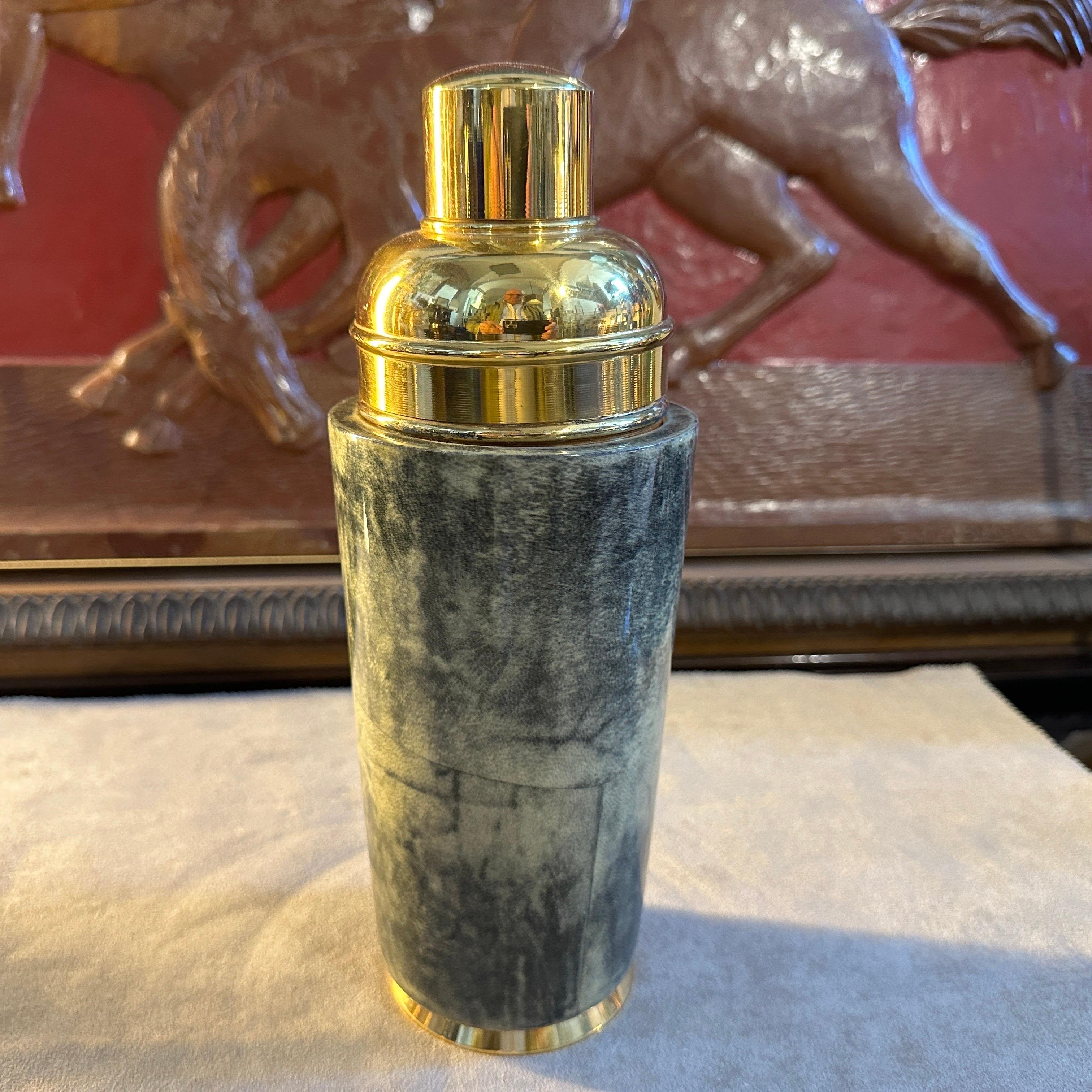 An elegant brass and green painted goatskin cocktail shaker designed and manufactured in the Fifties by Aldo Tura in Milano. Aldo Tura (1909 -1963) met his greatest success during the 1950s, keeping artisan manufacturing alive in his production and