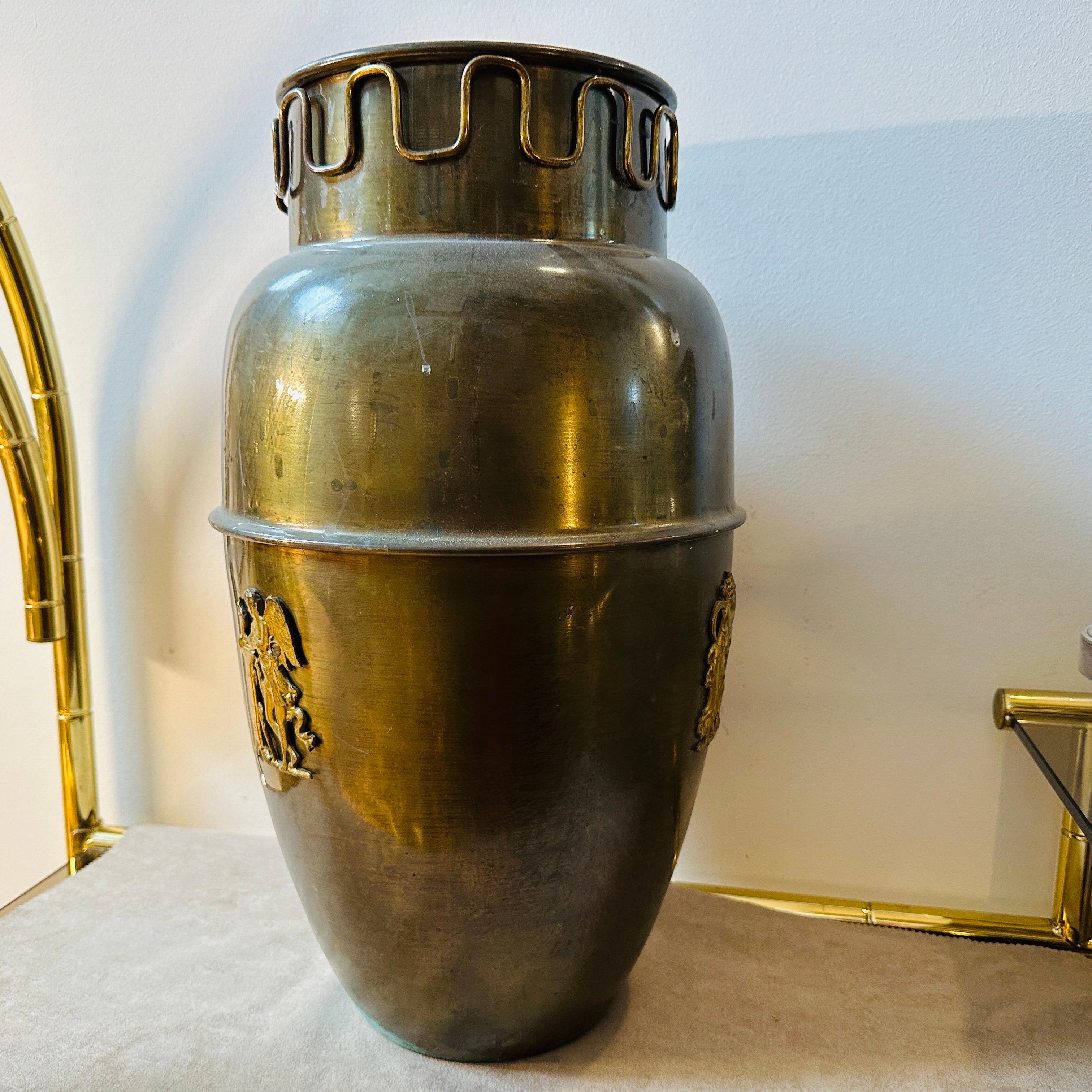 This brass umbrella stand is a stylish and collectible piece of furniture. Brass was a popular material for Mid-Century Modern designs, and it imparts a sleek and timeless look, the original patina and the original condition of the brass gives it a