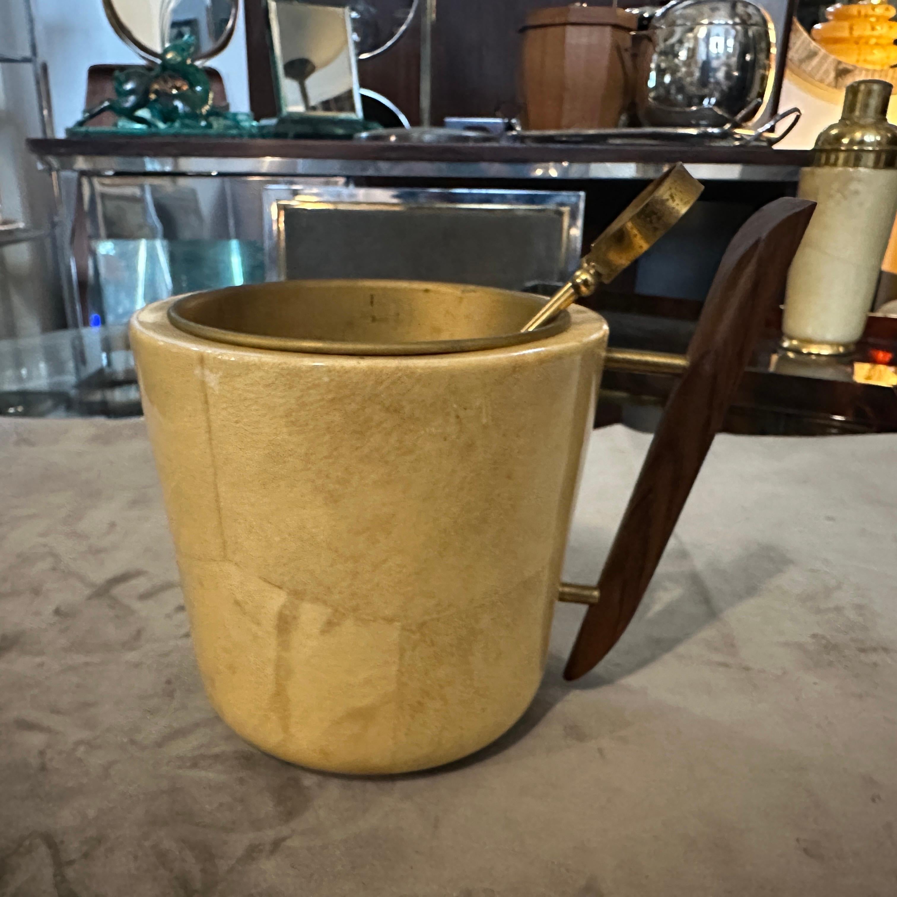 Vintage 1950s Mid-Century Modern Brass, Wood & Goatskin Ice Bucket by Aldo Tura
A rare and highly collectible piece of Italian design, this vintage ice bucket by the celebrated designer Aldo Tura is a stunning example of Mid-Century Modern
