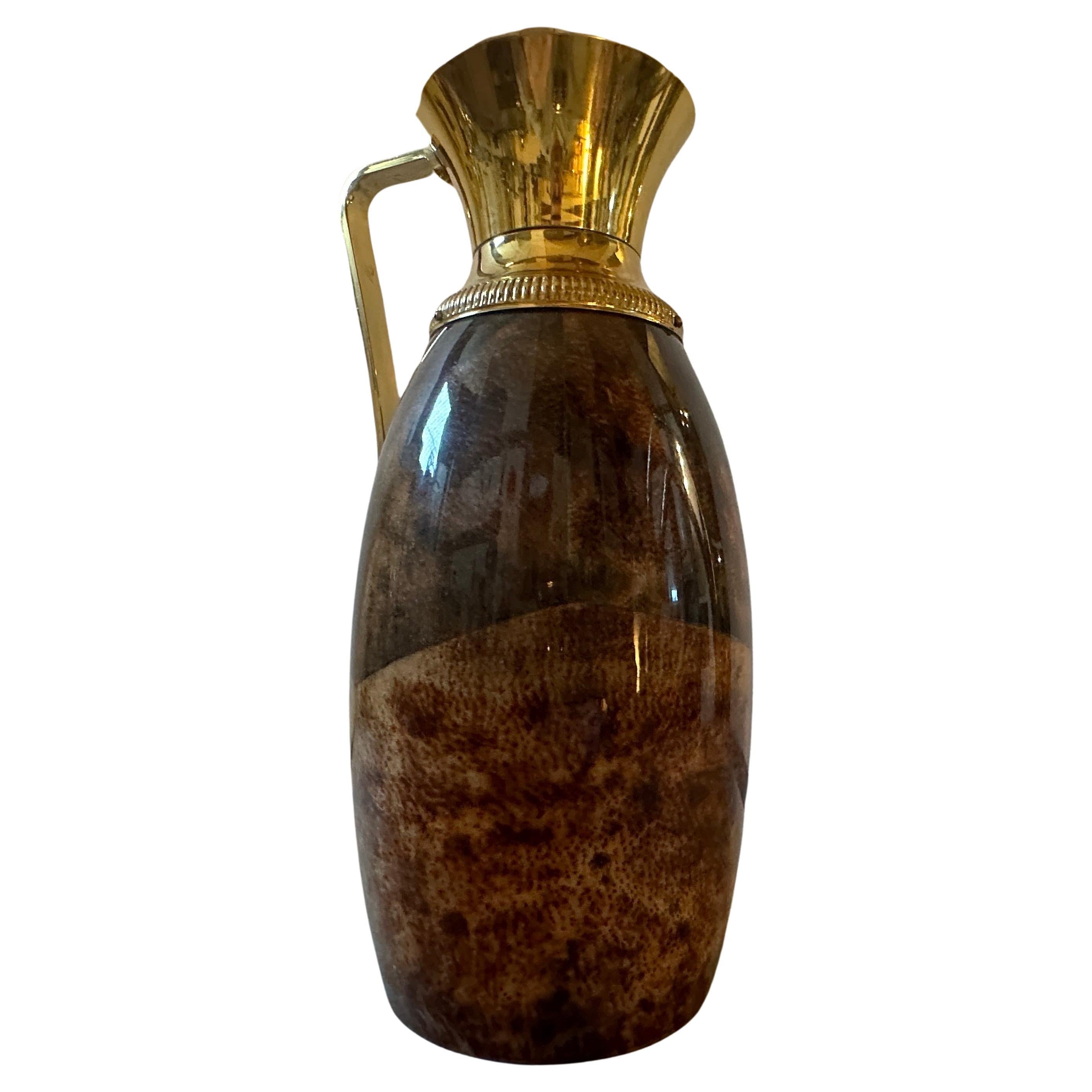 A thermos carafe designed by Aldo Tura, it has been manufactured in Milano in the Fifties by Macabo, it's in lovely vintage conditions. A 1950s Mid-Century Modern Brown Goatskin and Brass Carafe by Aldo Tura showcases the distinctive design