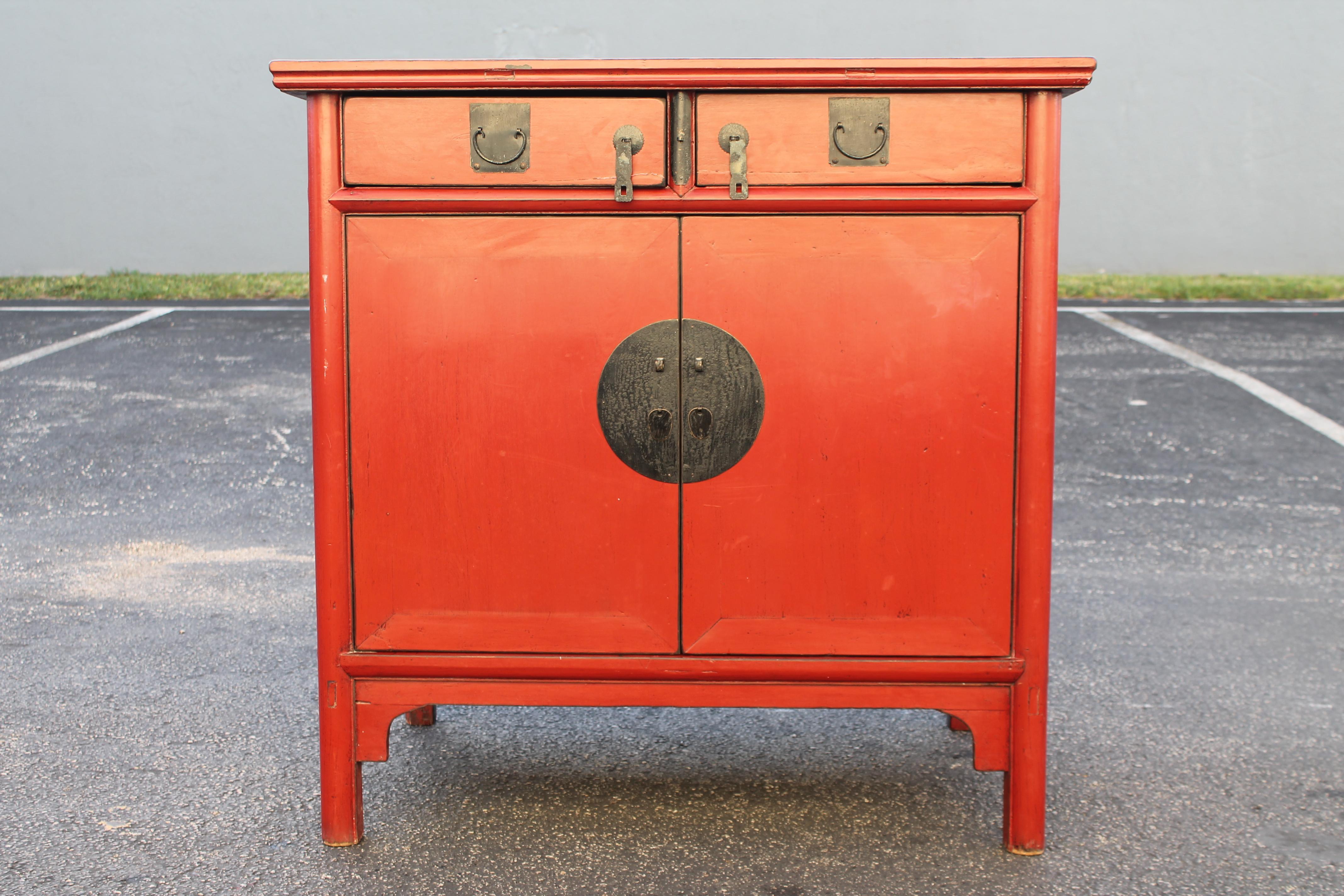 1950's Mid Century Chinoise Red Cabinet. Good storage and brass hardware.