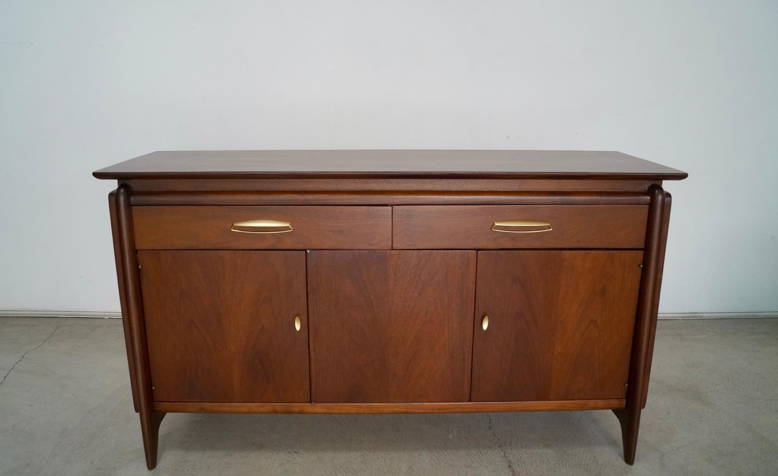 Vintage original Mid-century Modern sideboard for sale. Designed by John Van Koert for Drexel, and manufactured in 1959. It's part of the Projection series, and is beautifully designed. It's made of walnut, and has been professionally refinished. It