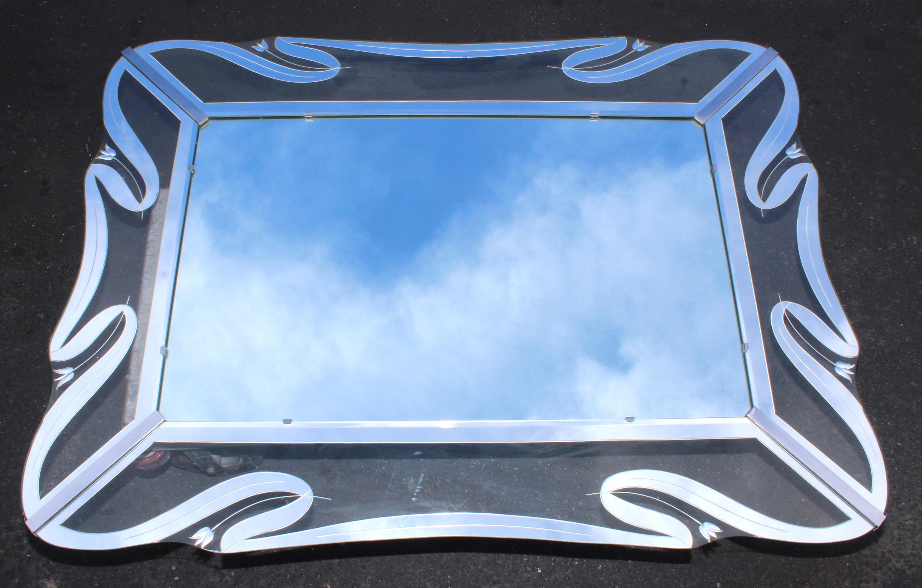Stunning 1950s Mid-Century Modern, clear and mirror etched glass frame mirror with chrome hardware.