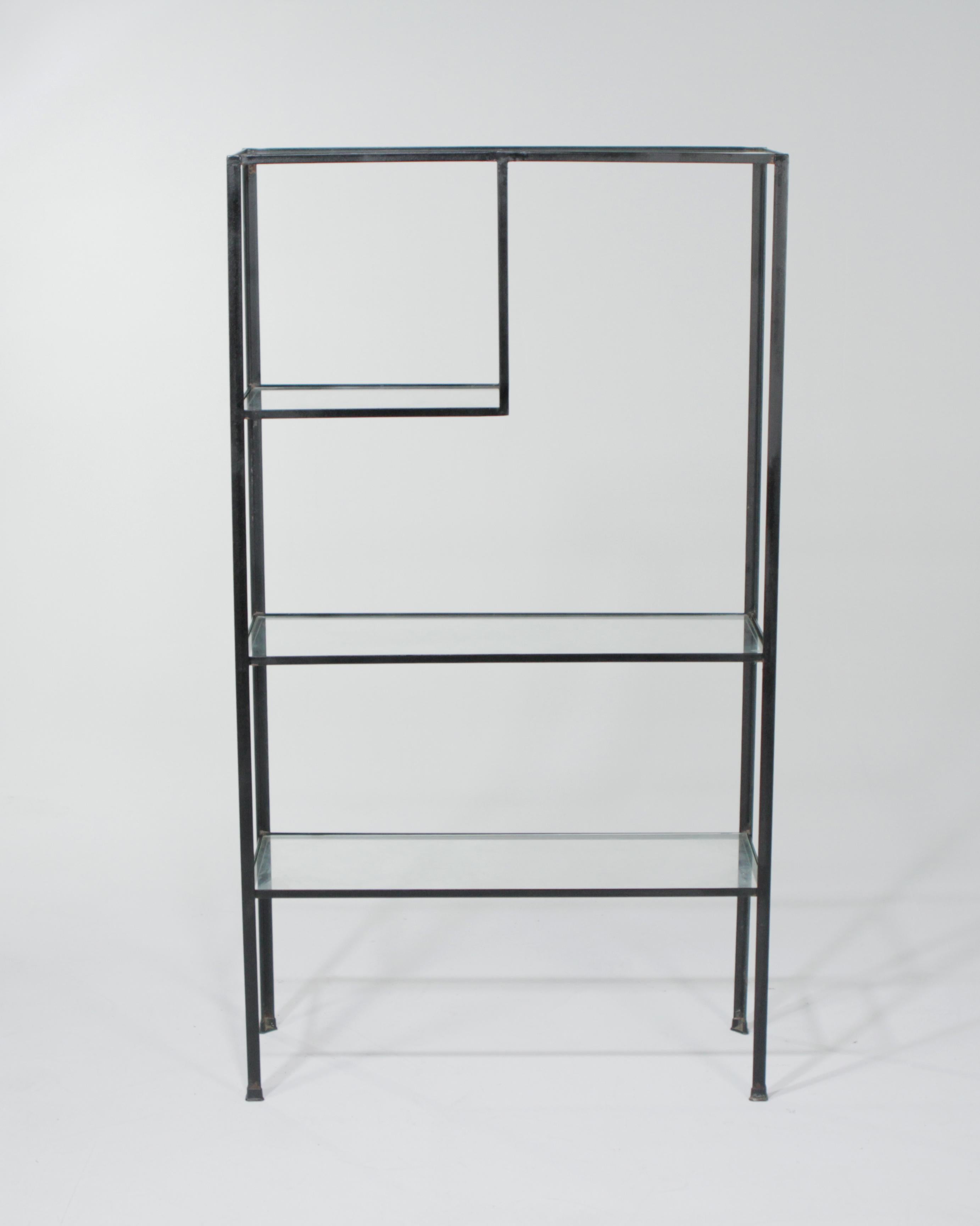 1950s Frederick Weinberg midcentury angle iron shelf unit. This is the shorter version of the well known Frederick Weinberg shelf that has a built in lamp.
  