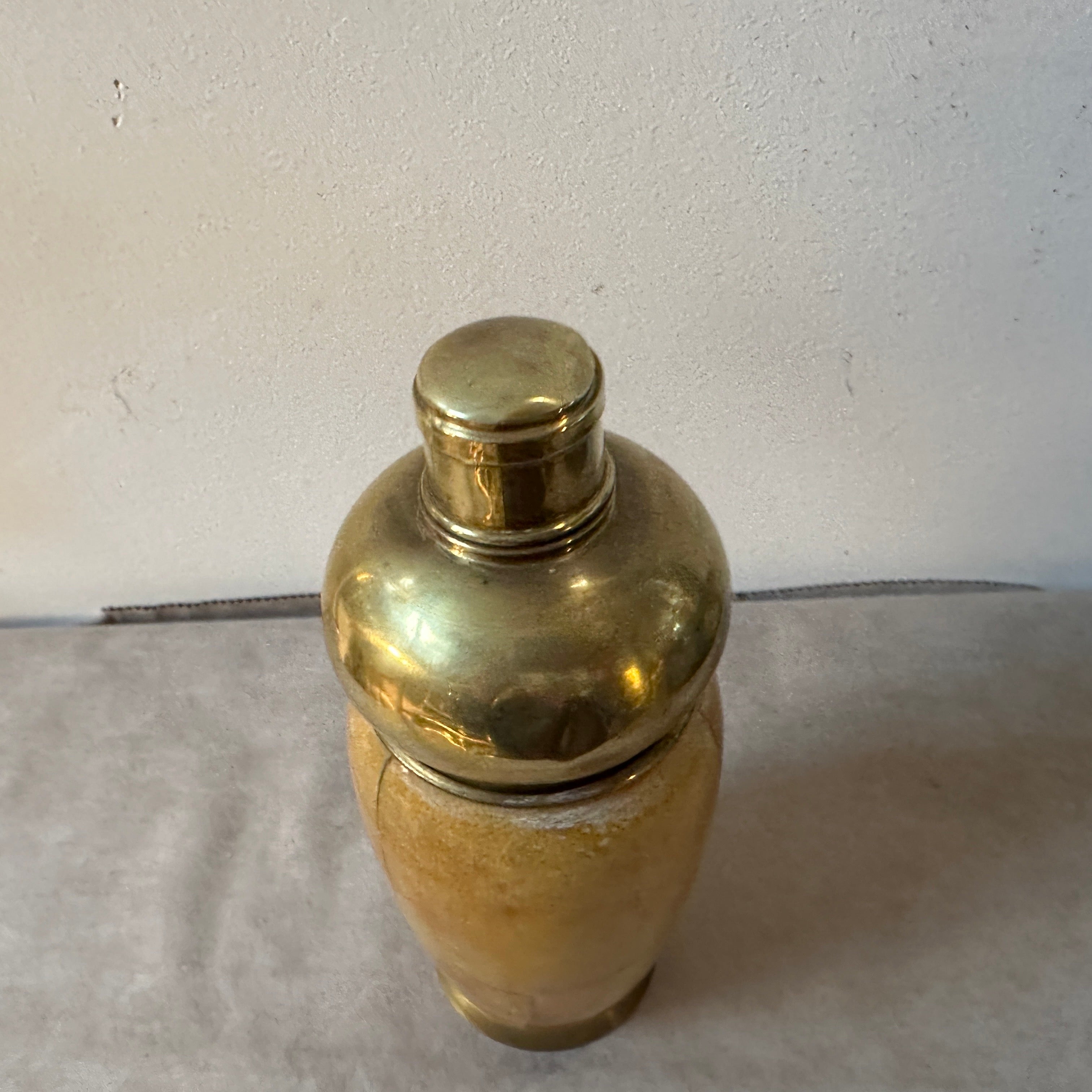 A cocktail shaker designed by Aldo Tura, it has been manufactured in Milano in the Fifties by Macabo, it's in vintage conditions with signs of use and age visible on there photos. This shaker showcases the distinctive design characteristics