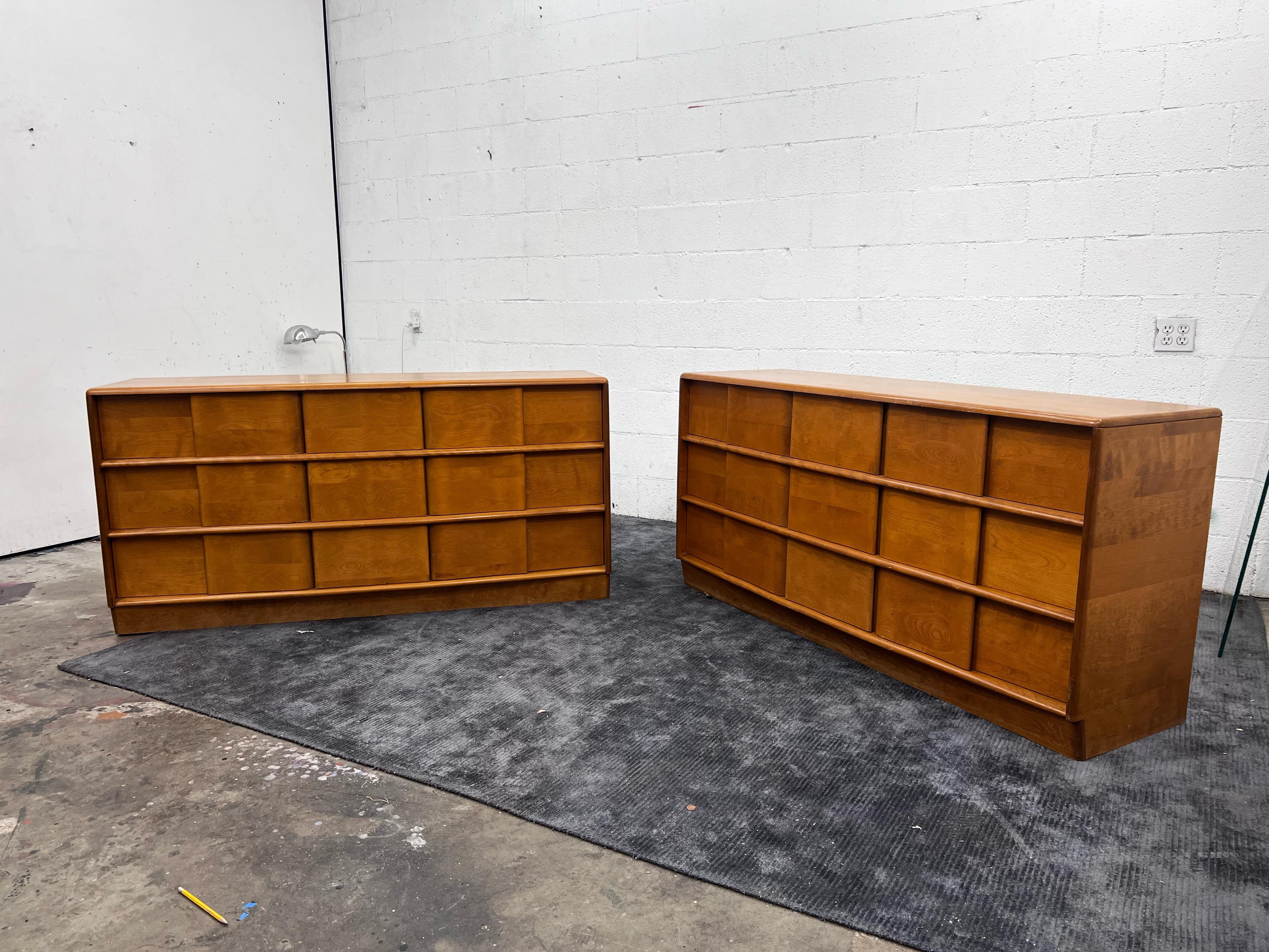 Two available. 
Beautifully designed large 9 drawer dresser with a wavy front, lots of storage, and easy to open drawers that glide smoothly. 

The original finish has aged to a dark amber/ tobacco color.

The Heywood Wakefield’s makers mark