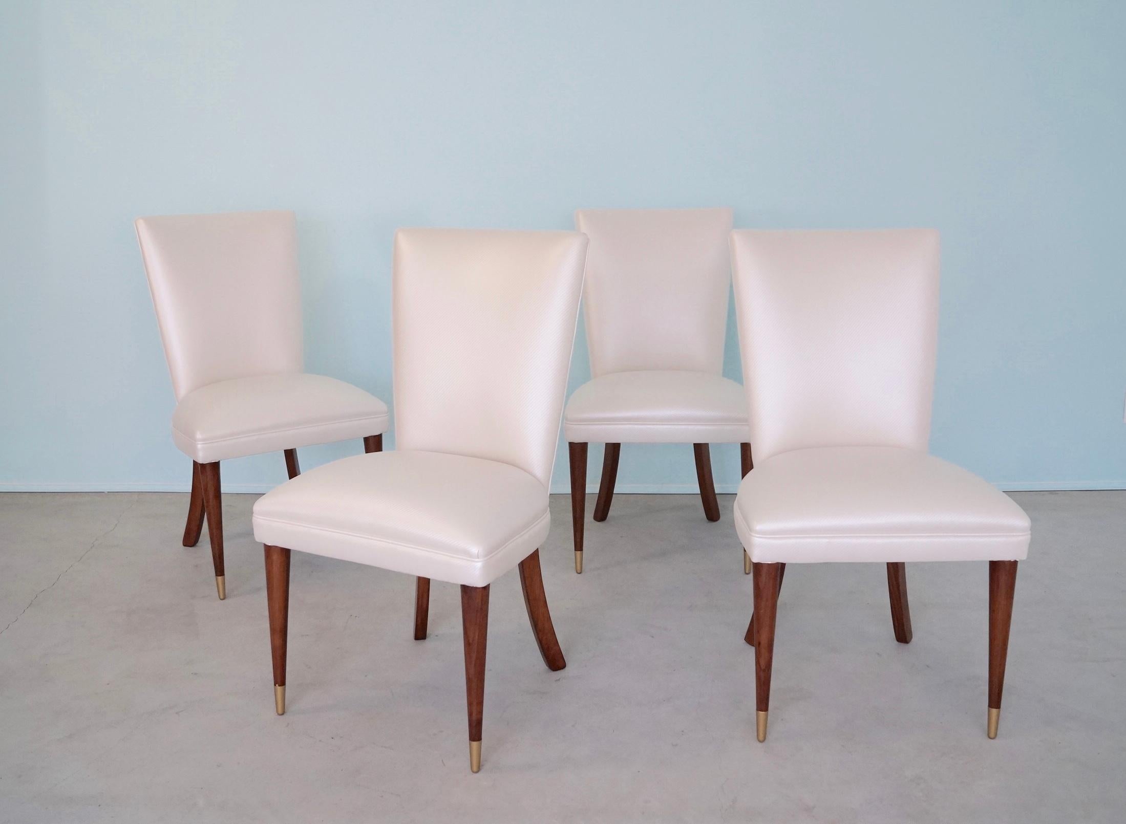 We have this incredible set of four original Mid-century Modern dining chairs for sale. They were manufactured in the 1950's, and are of exceptional quality and design. The chairs have springs, and the backrest has webbing. They are solid, and have