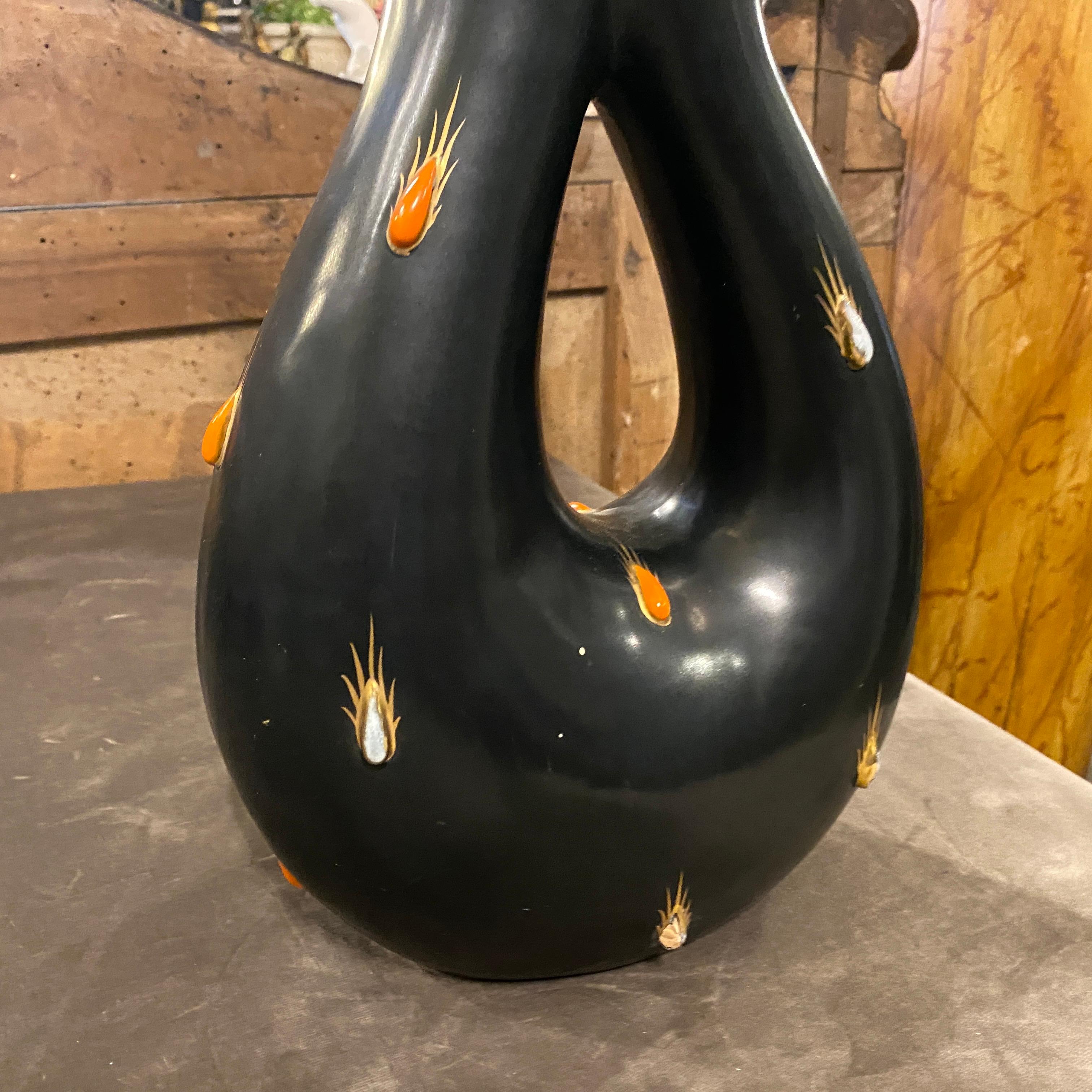 An amazing black and red ceramic vase made in Italy in the Fifties by famous manufacturer Rometti. It's marked on the bottom. The dimensions and the particular shape make this object unique and a superb example of mid-century modern italian ceramic.