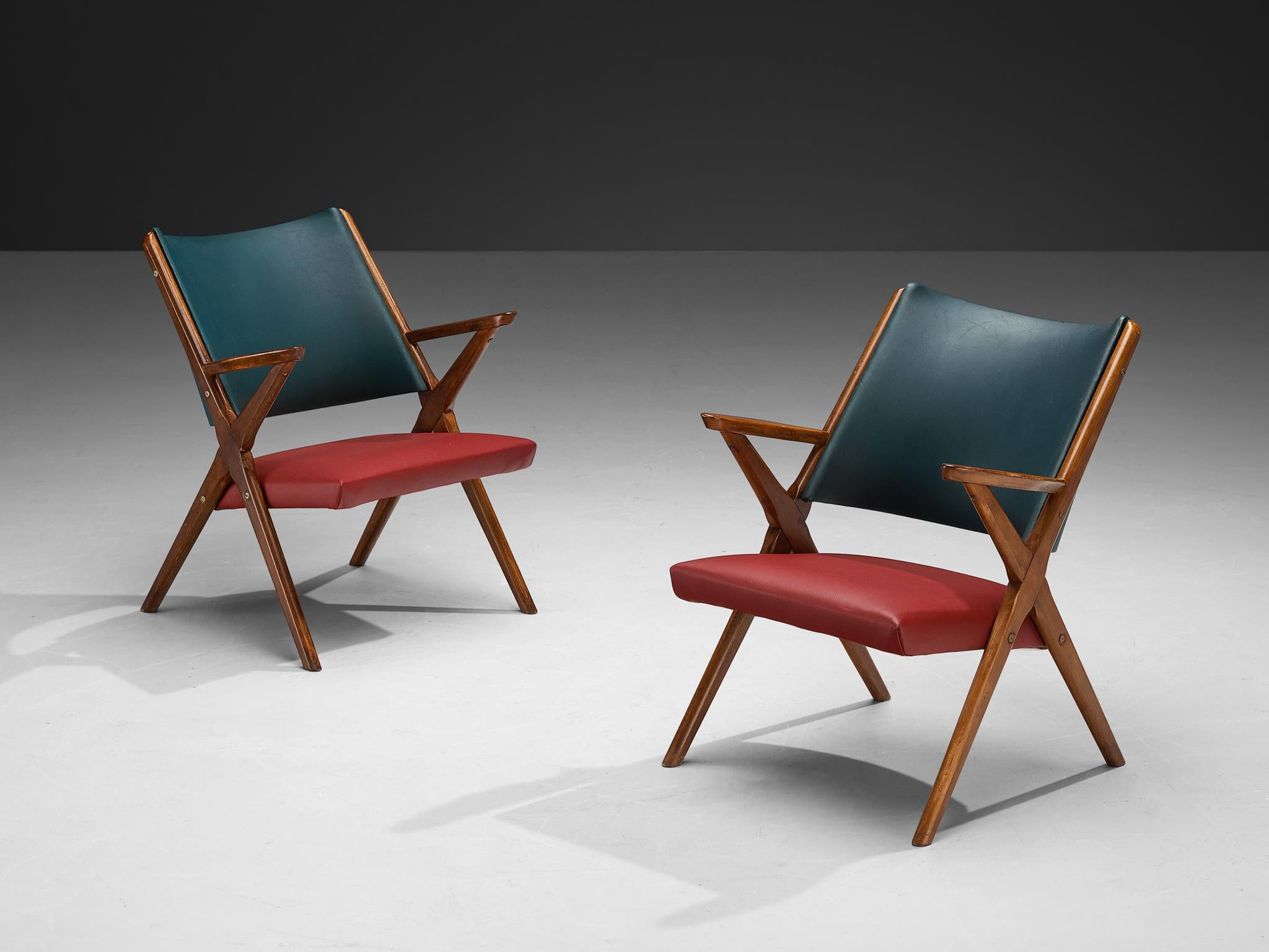 Armchairs, stained beech, faux leather, Italy, 1950s

Italian armchairs exemplary of 1950s mid-century modern design. The wooden structure employs an elegant interplay of intersecting angular element, forming an X-shaped framework on both sides. The
