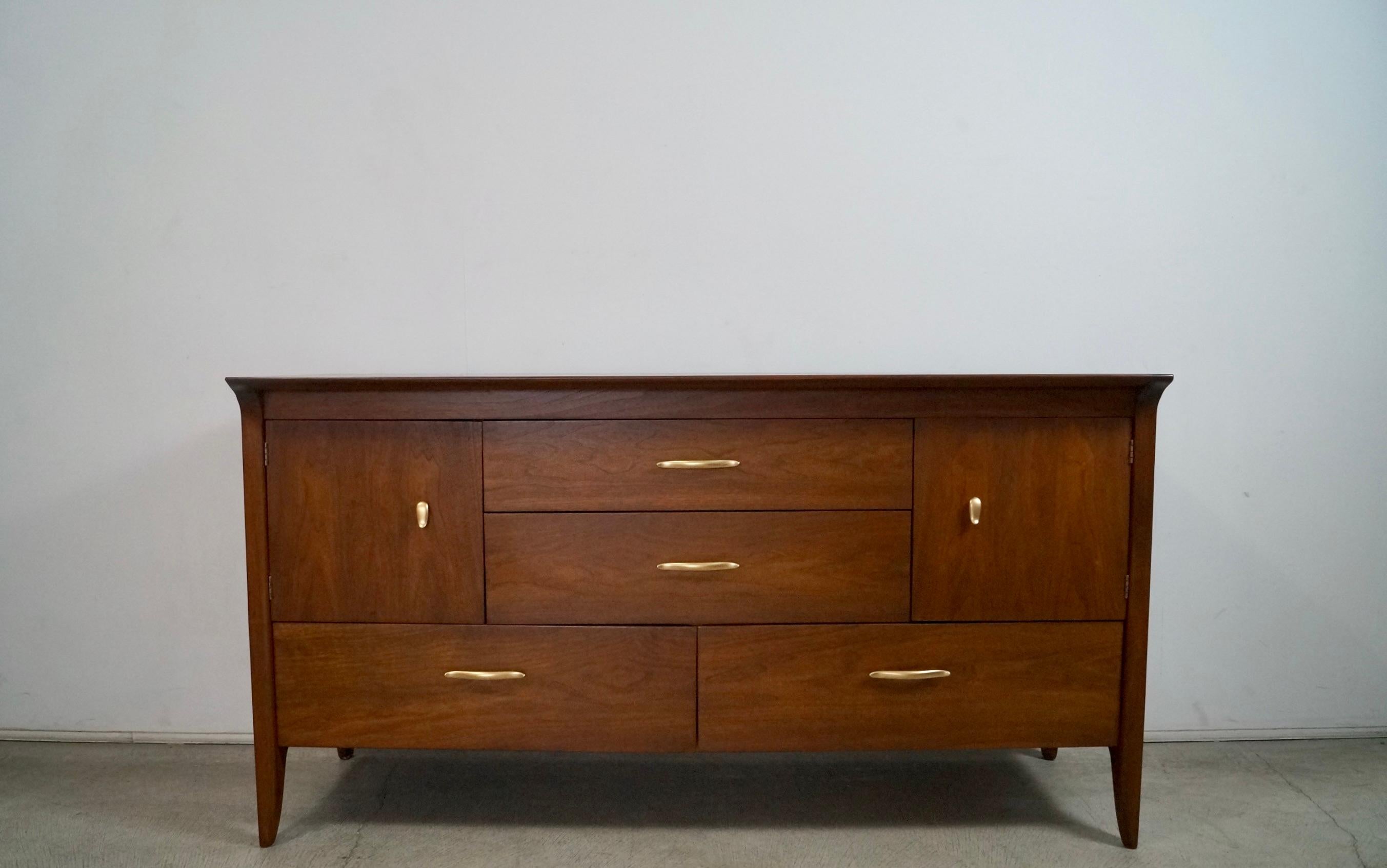 Vintage original Midcentury Modern credenza for sale. Designed by John Van Koert for Drexel in the 1950's, and part of the Profile series. Has been beautifully restored, and in wonderful restored condition. Has two cabinet doors that open up to a