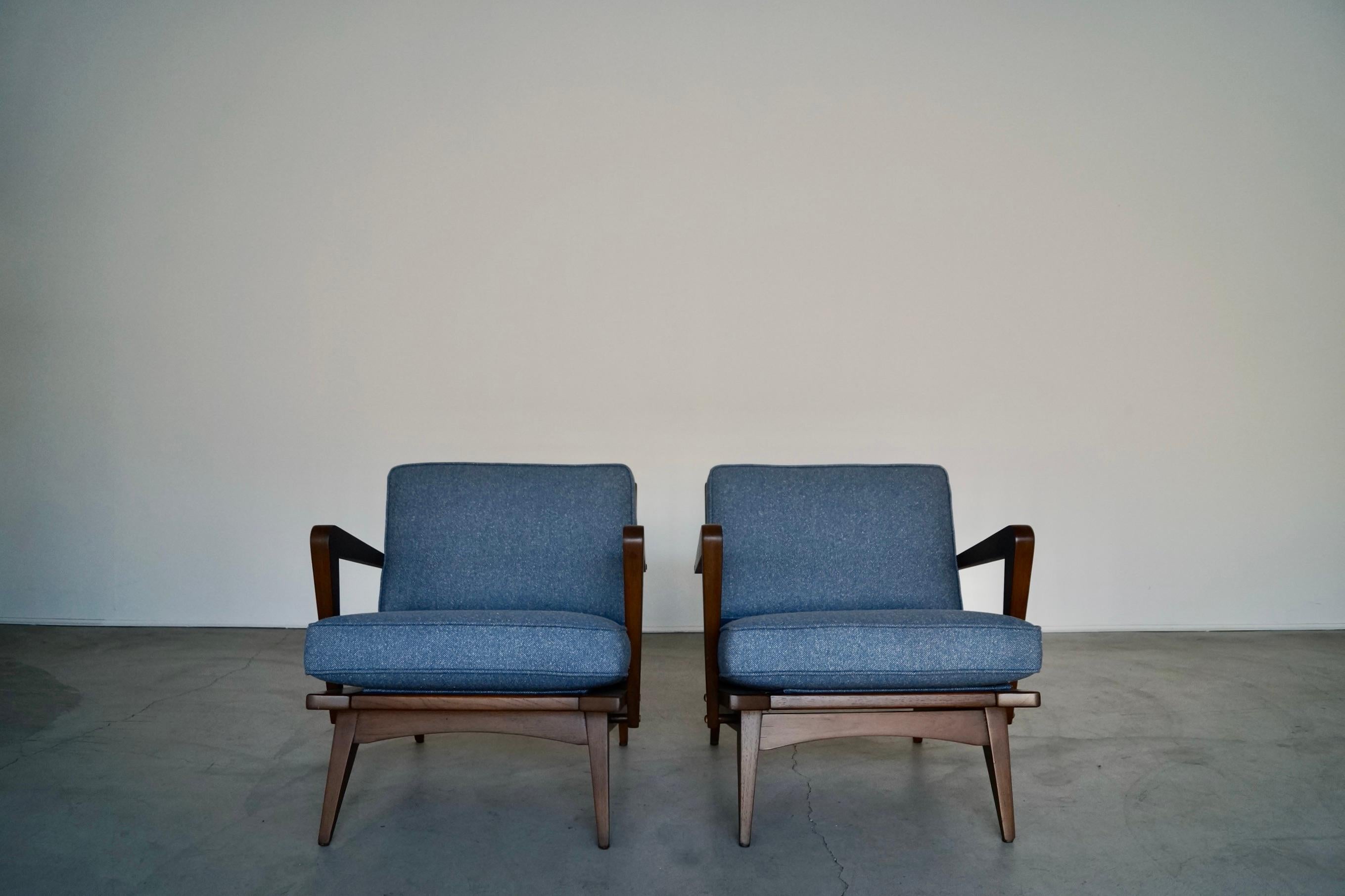We have this incredible pair of original 1950's Mid-century Modern lounge chairs for sale. They have beautiful Scandinavian lines, and are very rare. The frames have been professionally refinished in walnut, and have new webbing on the seat rests.
