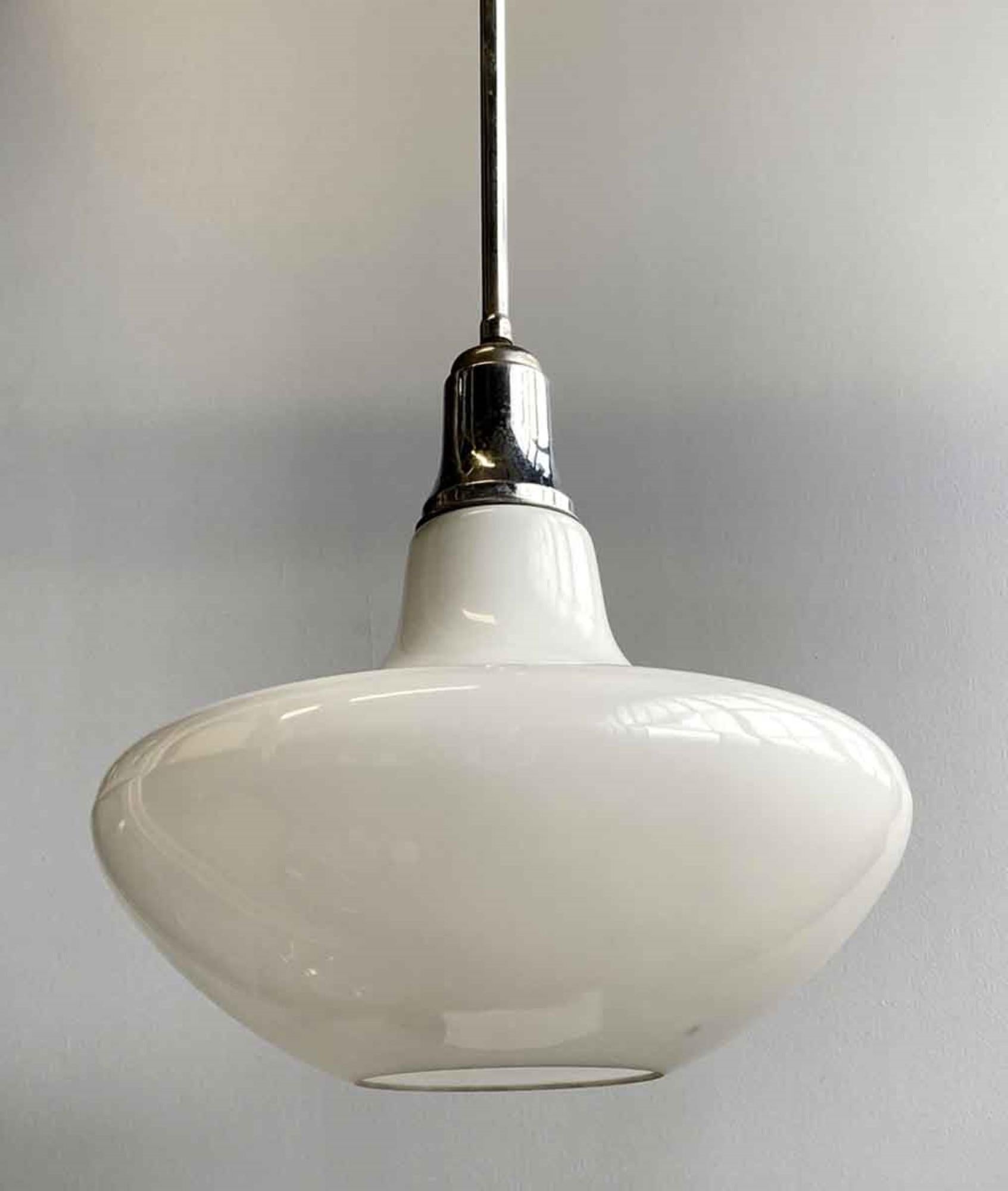 1950s Mid-Century Modern mushroom shaped white milk glass mushroom globe with a center hole for a spotlight. The fixture has the original nickel-plated brass hardware. This can be seen at our 400 Gilligan St location in Scranton. PA.