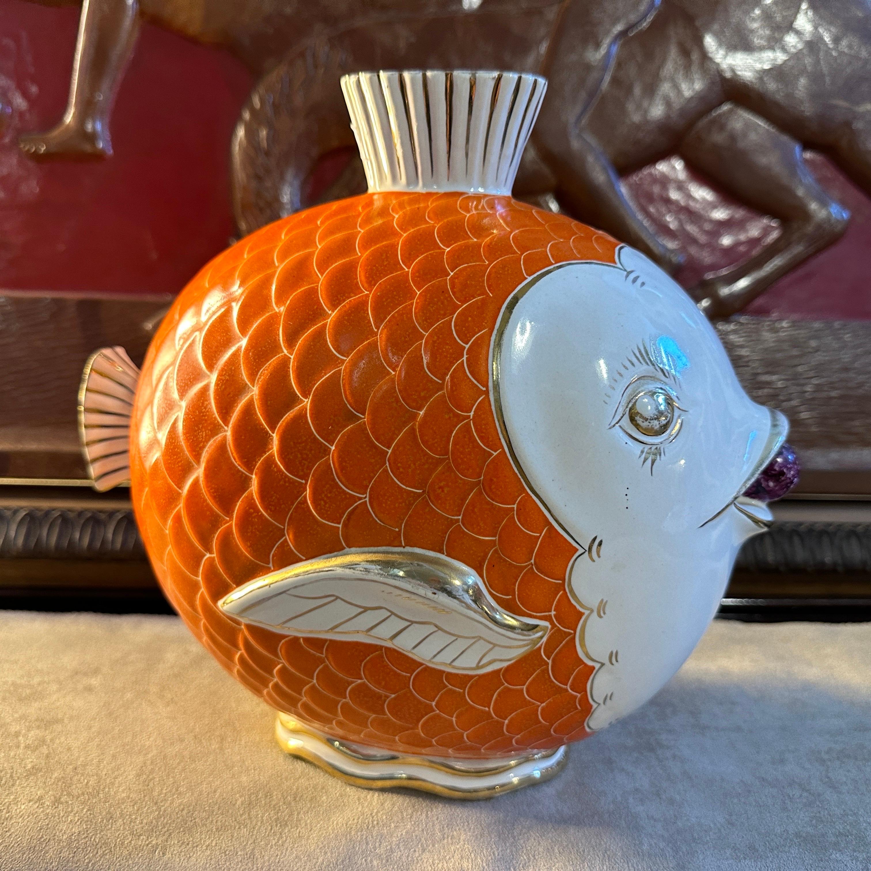 This Mid-Century Modern Ceramic Italian Fish Vase is a delightful blend of whimsy and sophistication, capturing the essence of mid-century design with its playful yet elegant aesthetic. Crafted in Umbertide Italy in the style of Pucci during the