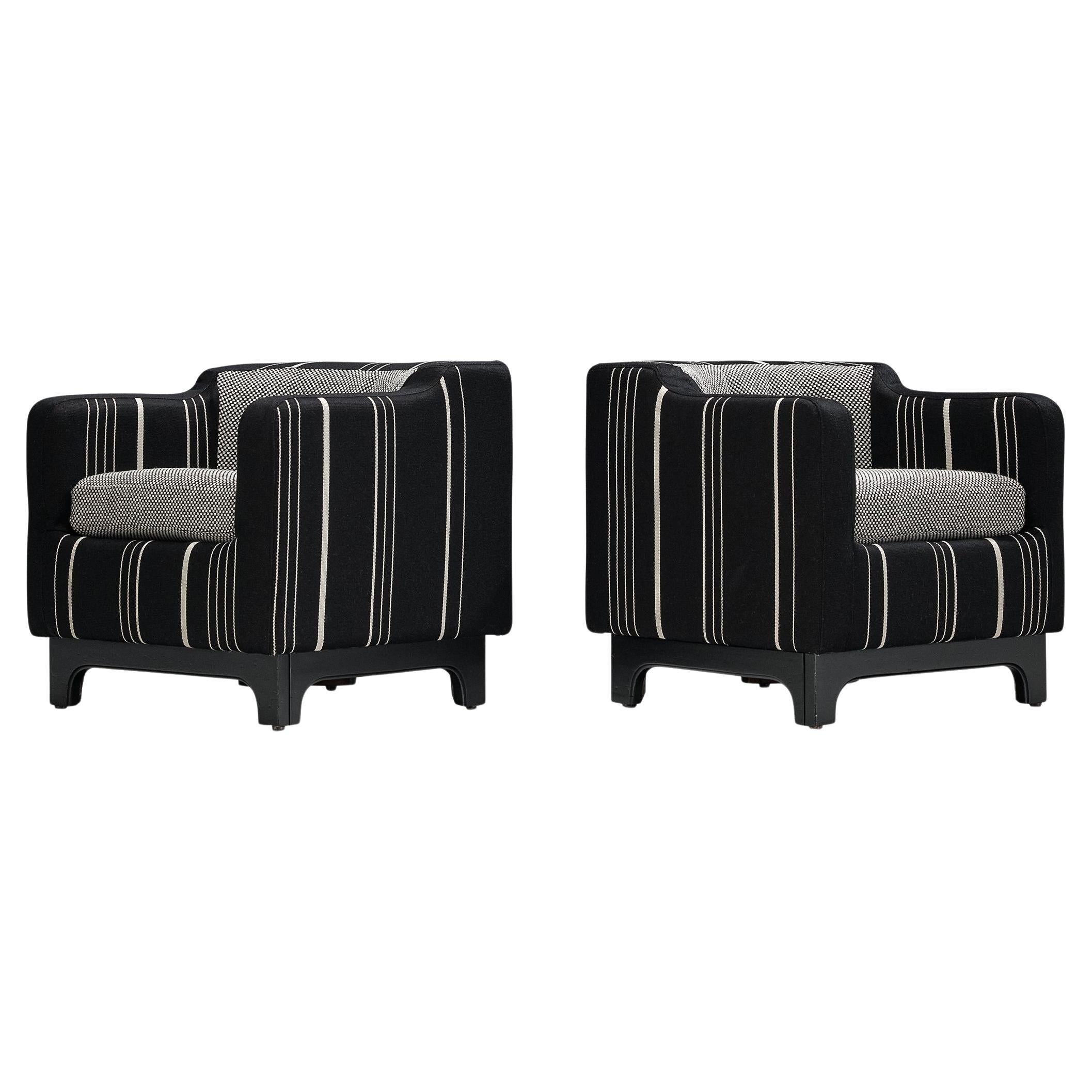 Pair of armchairs, fabric, lacquered walnut, Italy, 1950s

With their distinctive geometry and angular lines, these lovely pair of club chairs are the perfect embodiment of mid-century modern design. The armrests and backrest form a cohesive,