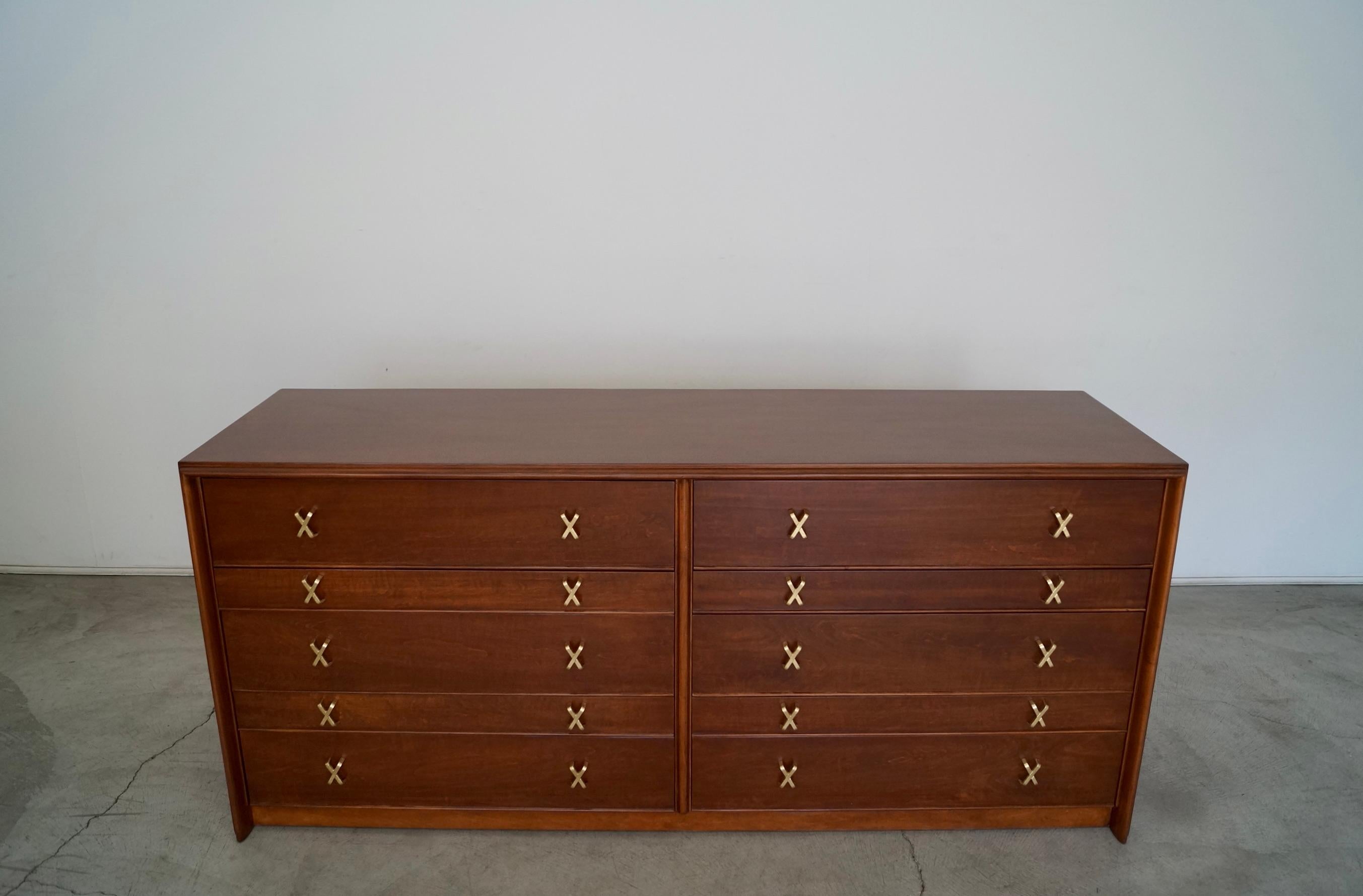 Vintage Mid-century Modern dresser for sale. Designed by Paul Frankl in the 1950's, and manufactured by the Johnson Furniture Company. This design is one of the most celebrated designs by Paul Frankl, and is iconic of his work. It has simple and