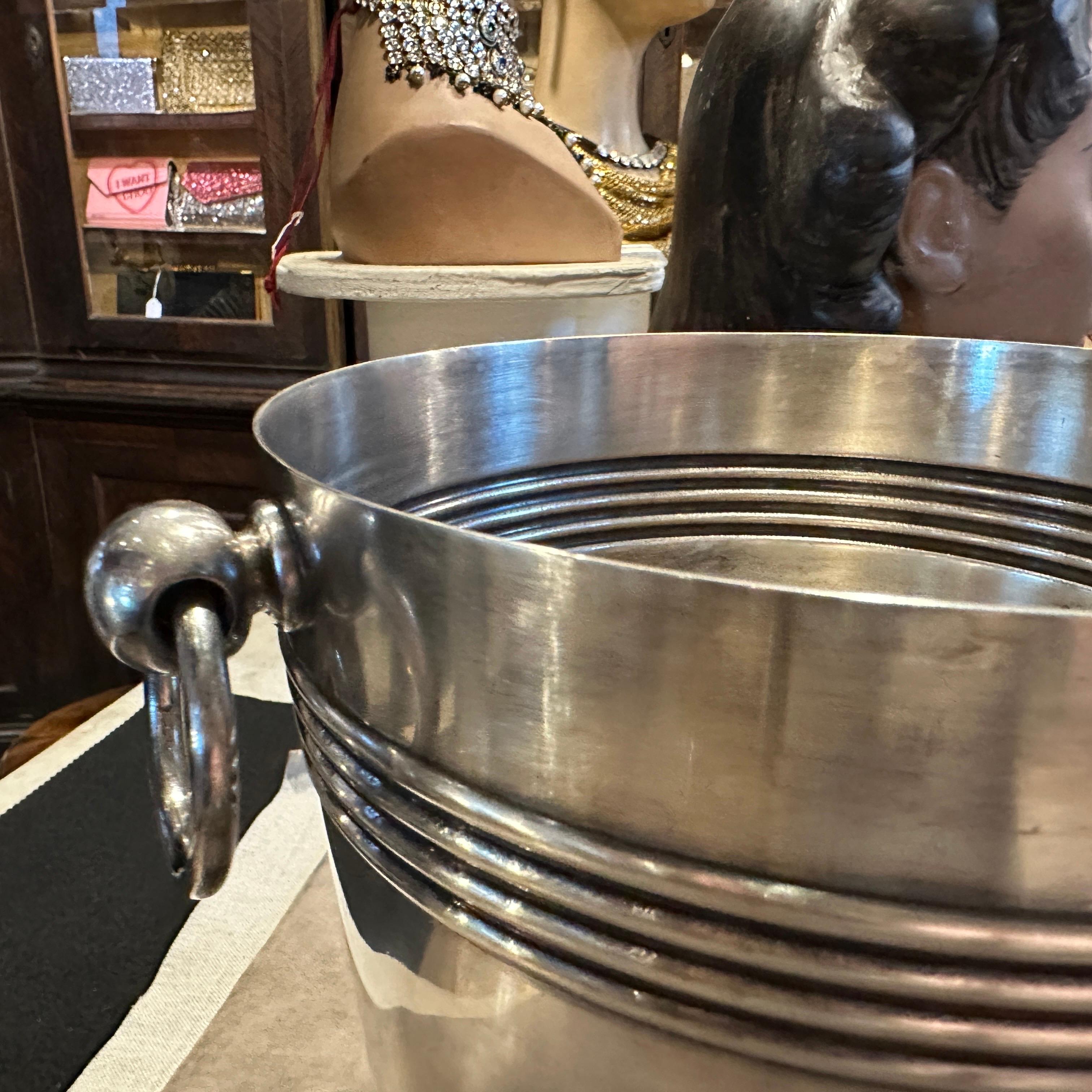 This set of  French Wine Cooler and ice bucket designed by Luc Lanel for Gallia Christofle is a sleek and elegant piece of barware, reflecting the minimalist and contemporary design trends of the era. It has been crafted from high-quality