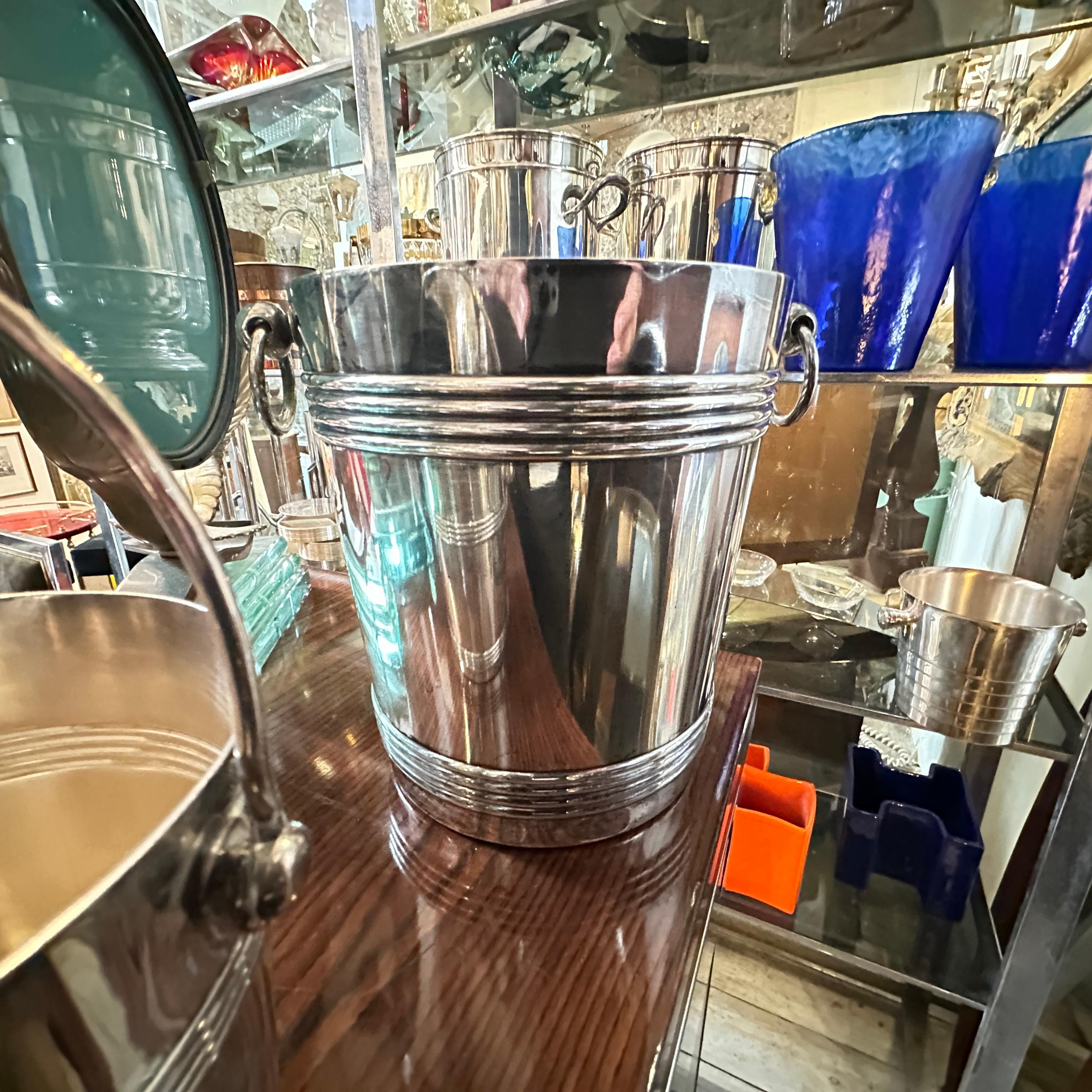 This set of  French Wine Cooler and ice bucket by gallia Christofle is a sleek and elegant piece of barware, reflecting the minimalist and contemporary design trends of the era. It has been crafted from high-quality silver-plated metal. Silver