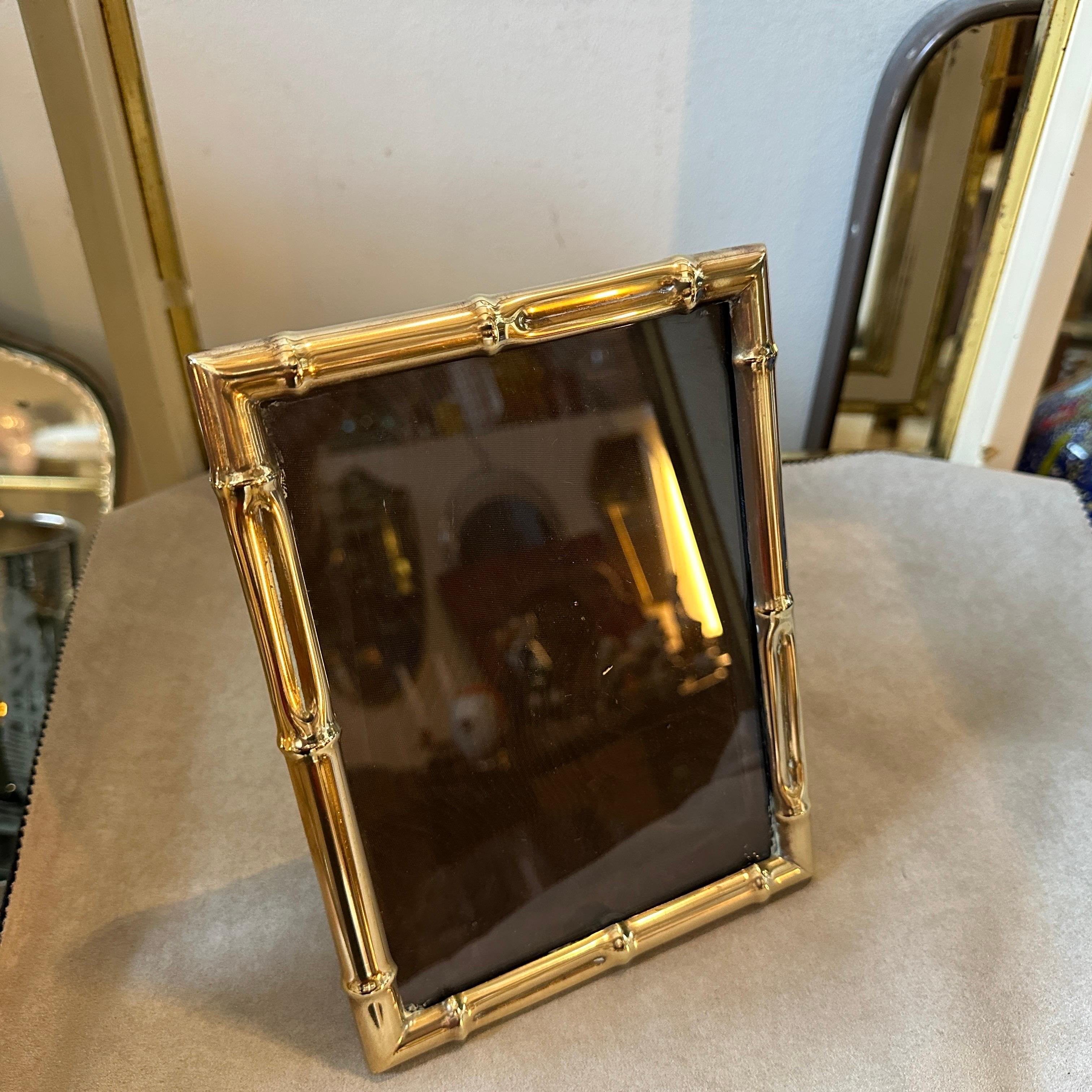 A picture frame that embodies the essence of the 1950s Mid-Century Modern era, crafted with impeccable attention to detail and sophistication. This solid brass frame recalls the bamboo popularized by Italian designer Tommaso Barbi, exudes timeless