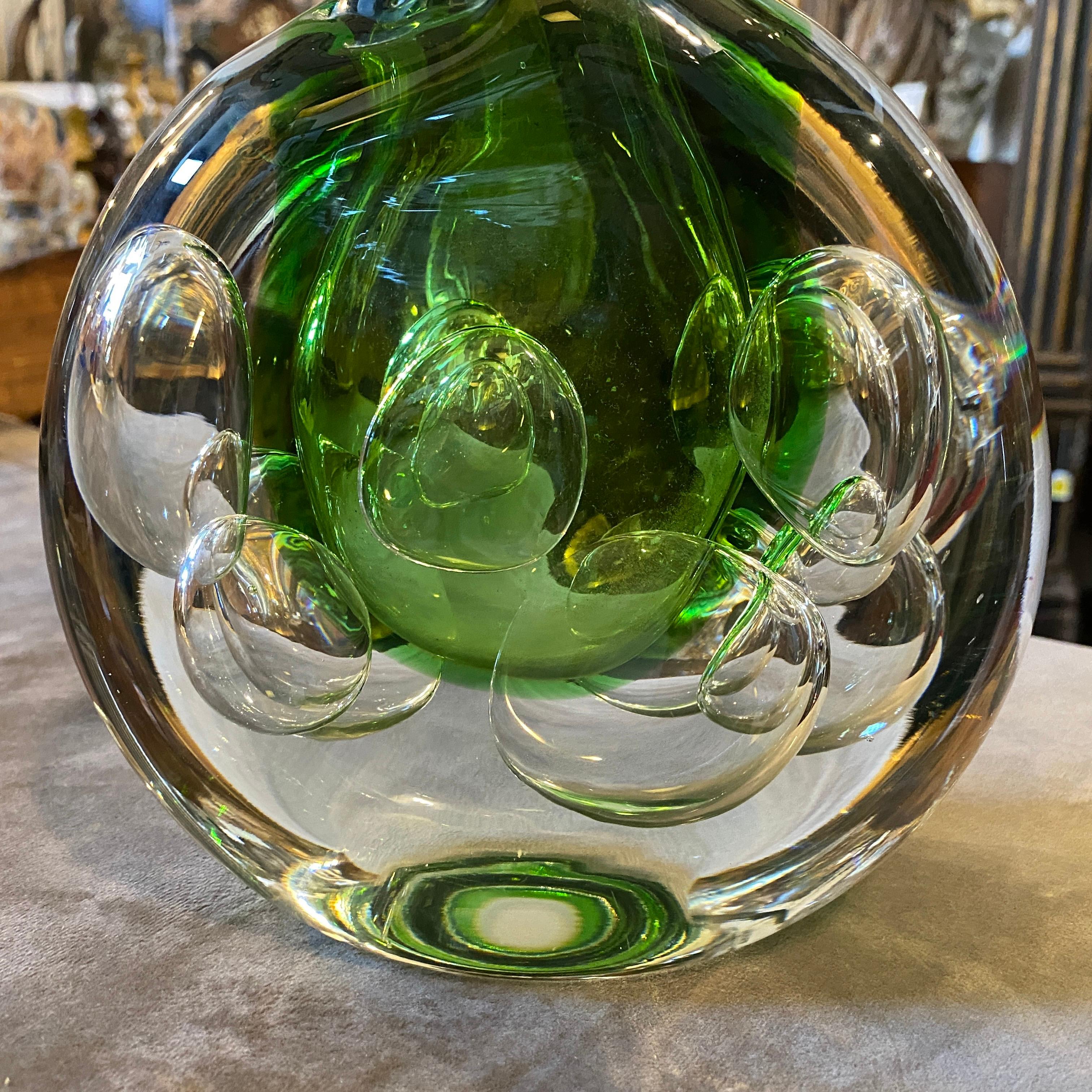 A stylish vase designed by Jaroslav Svoboda, heavy green sommerso glass it's in perfect conditions. The Sommerso technique is a popular glassblowing method that originated in Murano, Italy, in the late 1930s. However, it was later adopted and