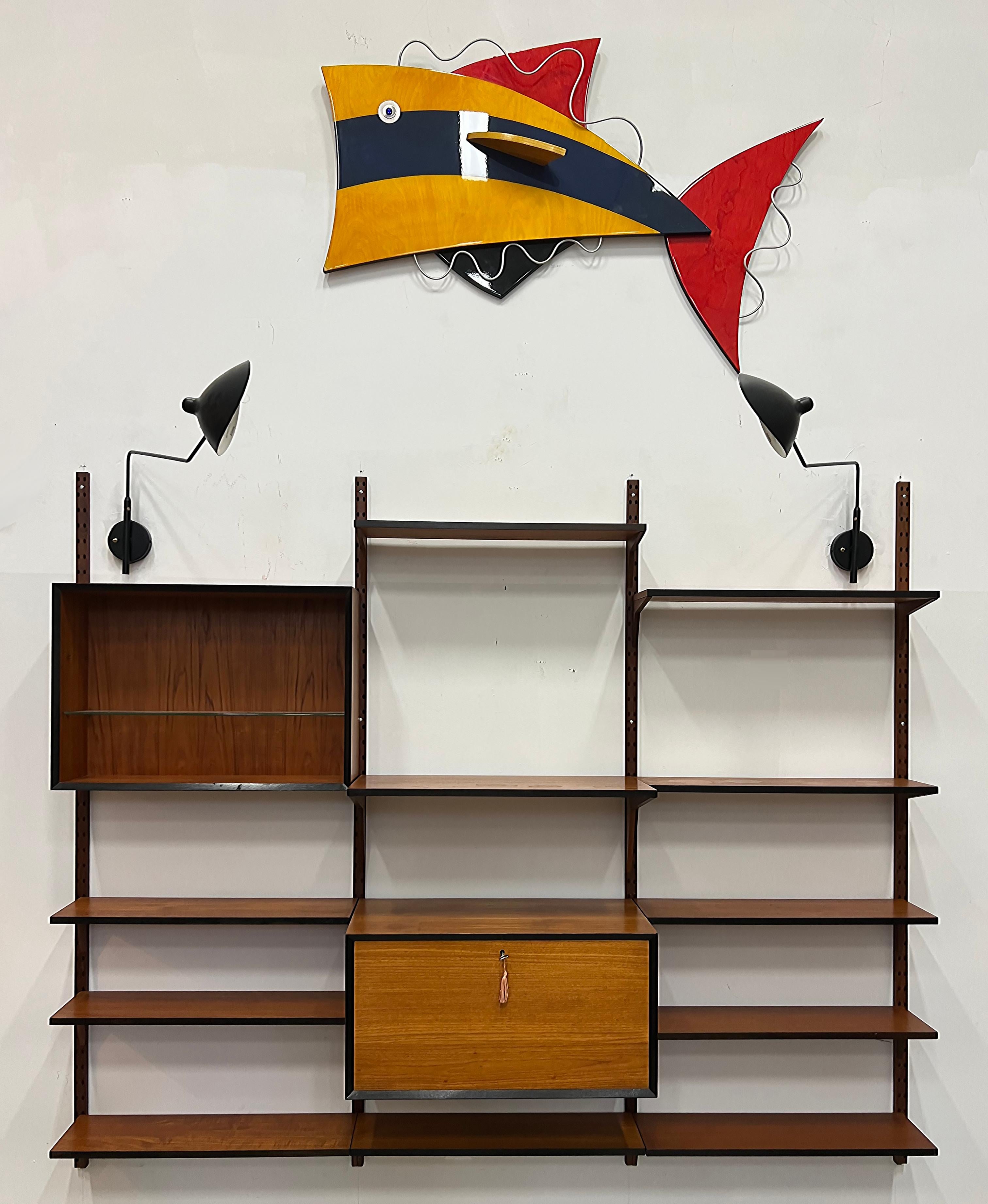 1950s Mid-century Modern Teak Wall Unit with Secretaire, Poul Cadovius Manner 

Offered for sale is a 1950s mid-century modern teak wall unit with 2 larger cabinet units including a secretaire. The secretaire  door drops to become a writing surface