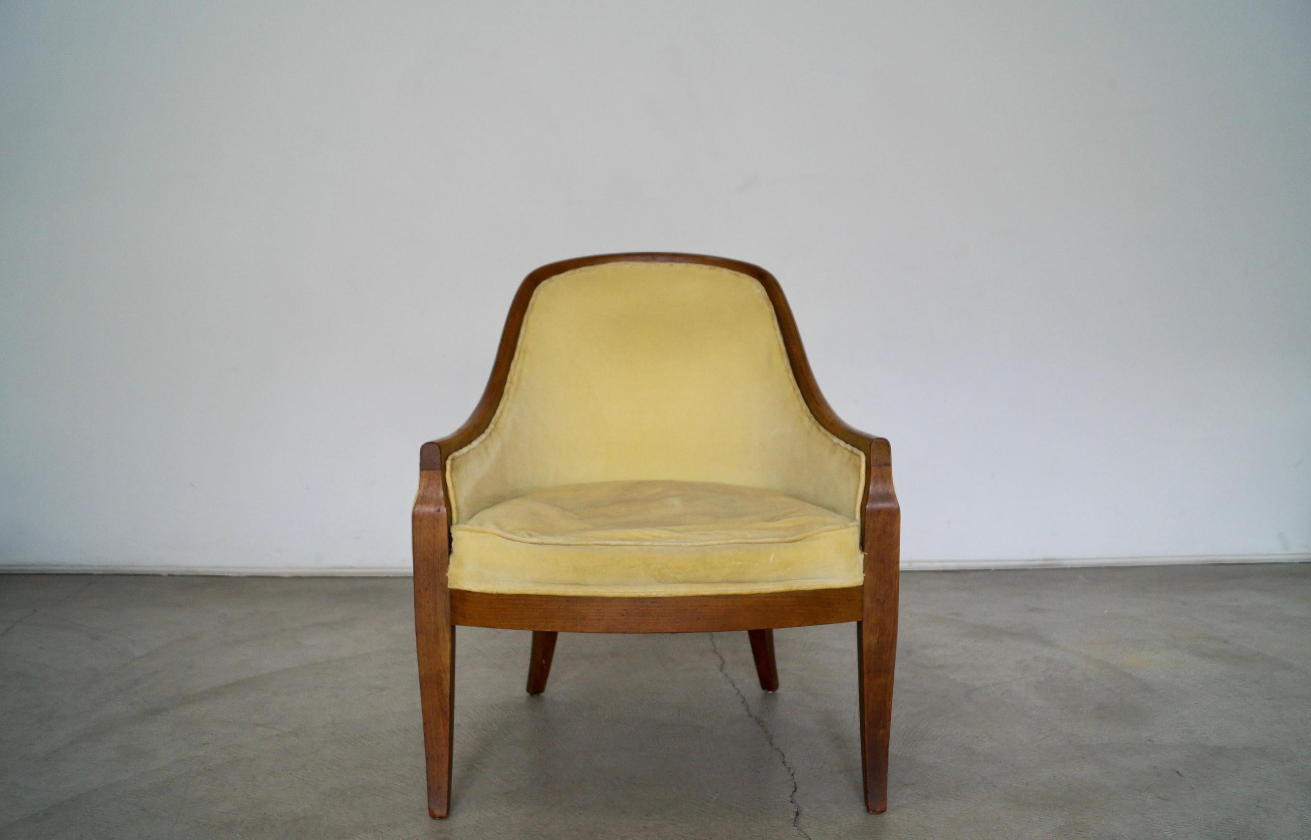 Vintage Mid-Century Modern gondola armchair for sale. Incredibly solid, and very well constructed. It has a solid walnut frame with coil springs on the seatrest. The velvet is work and needs to be reupholstered. the chair frame needs to be