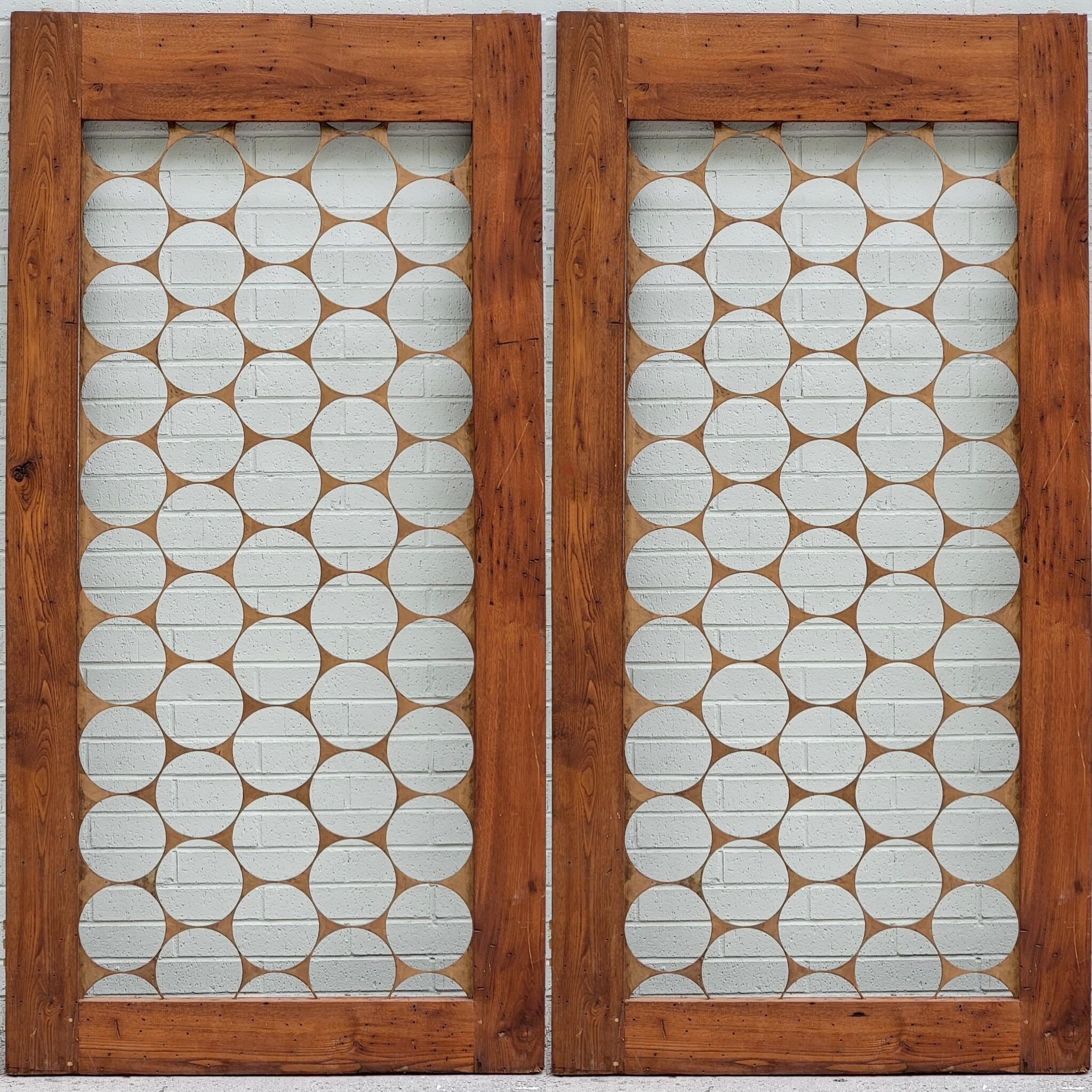 These are a special estate find out if Charleston! This is a pair of Mid-Century Modern wormy chestnut doors with gilded steel inset. They were in a prominent industrialist’s home for over 50 years….unused. Wormy chestnut is a rare wood too. It has