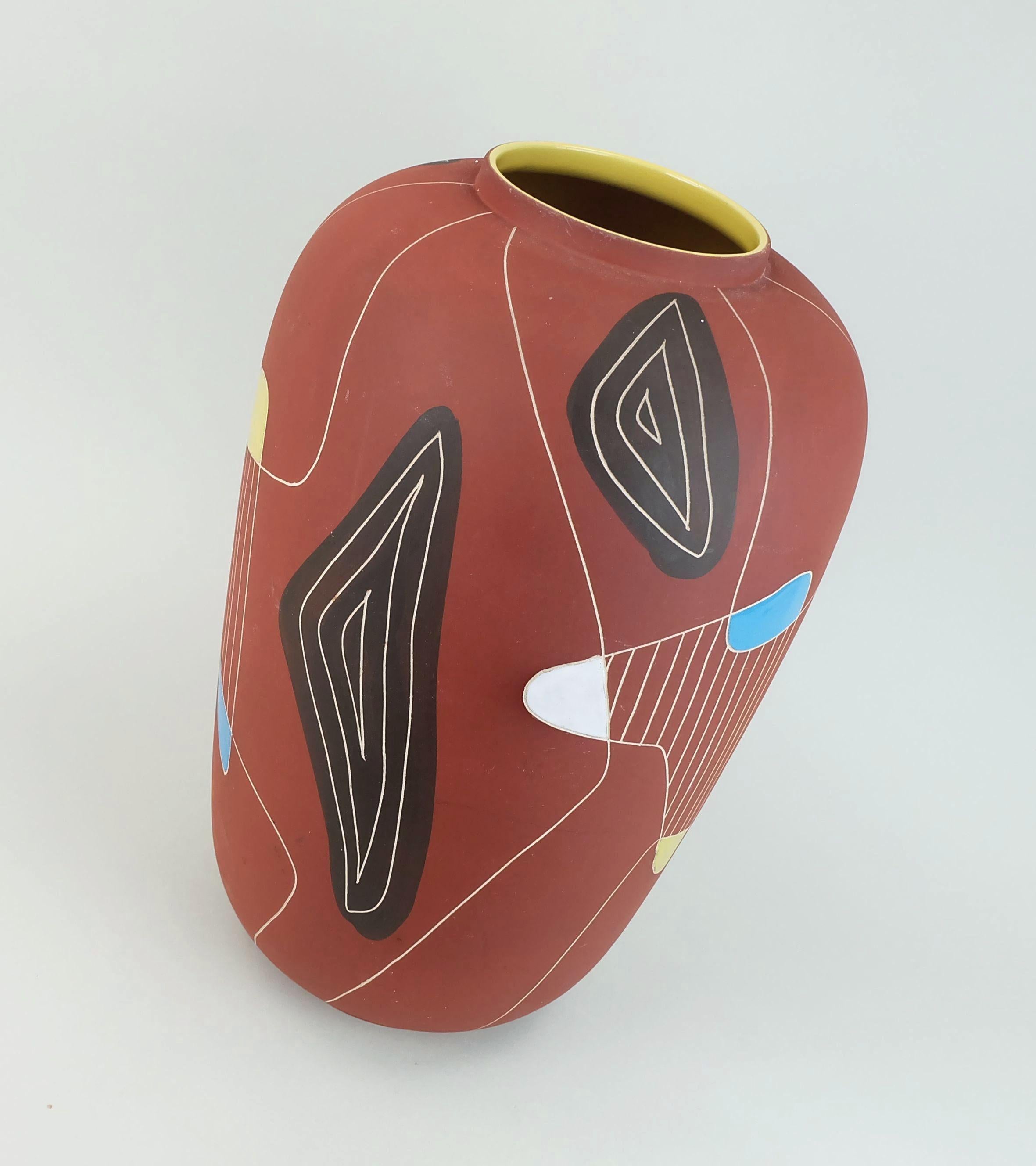 Very beautiful west german mid century ceramic vase manufactured by Bay-Keramik in 1957, decor 'Brasil'.
Unglazed surface with white incised decor combined with glossy colored fields. Model number 543-40. 

Dimensions in cm: 
Height 41.3 cm, width