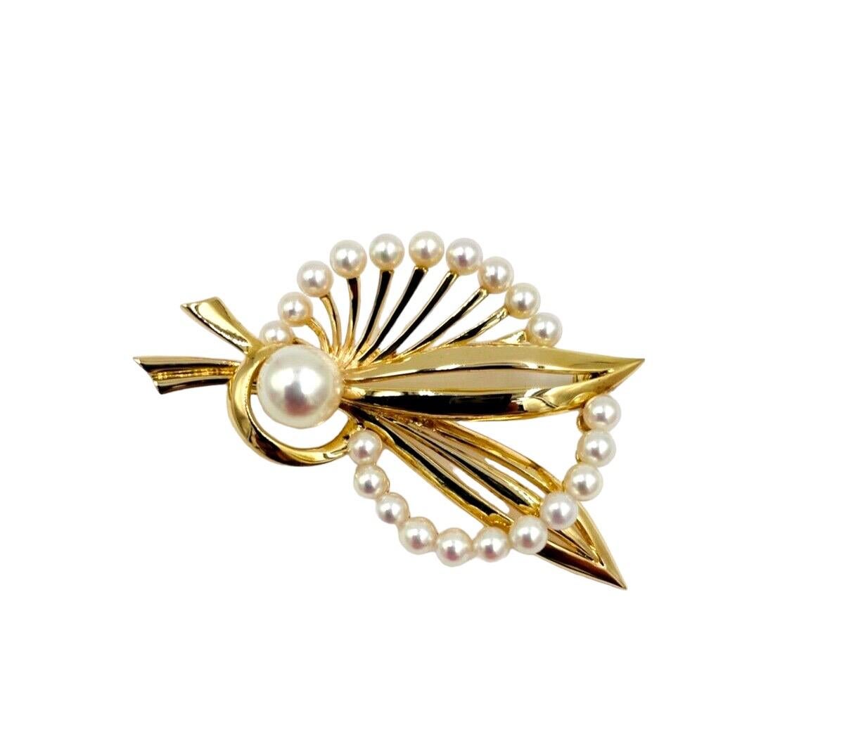 Mikimoto Cultured Pearl and Yellow Gold Brooch, circa 1950.

SPECIFICATIONS:

 PEARLS:  Cultured Pearls from 3.4mm to 7.6mm.

METAL:  14K yellow gold

WEIGHT:  10.7 grams.

DIMENSIONS:  1.7/8