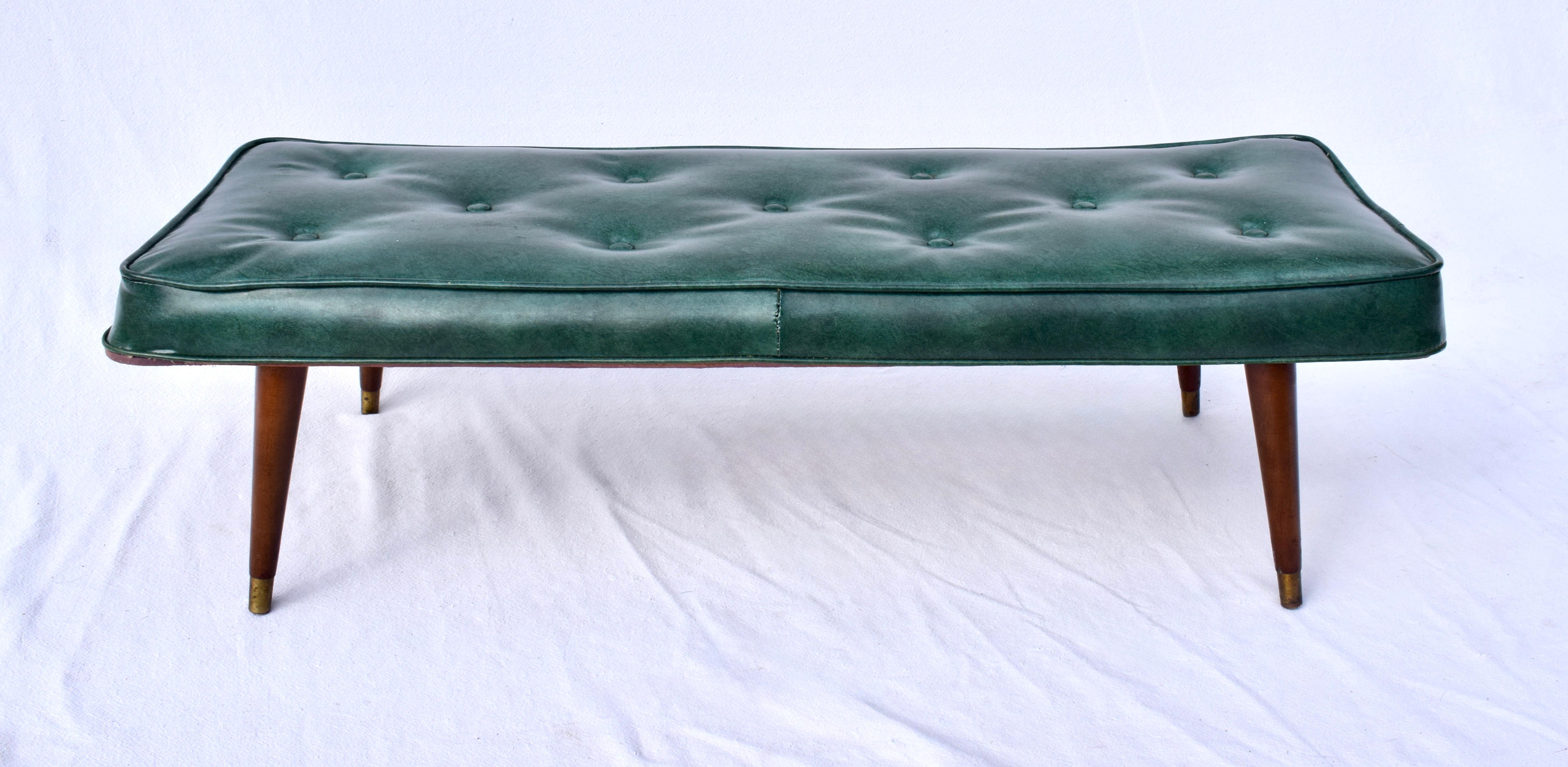 An all original 1950's Mid Century Modern Bench after Milo Baughman with brass cap tapered walnut legs. 
Generous size at nearly 50