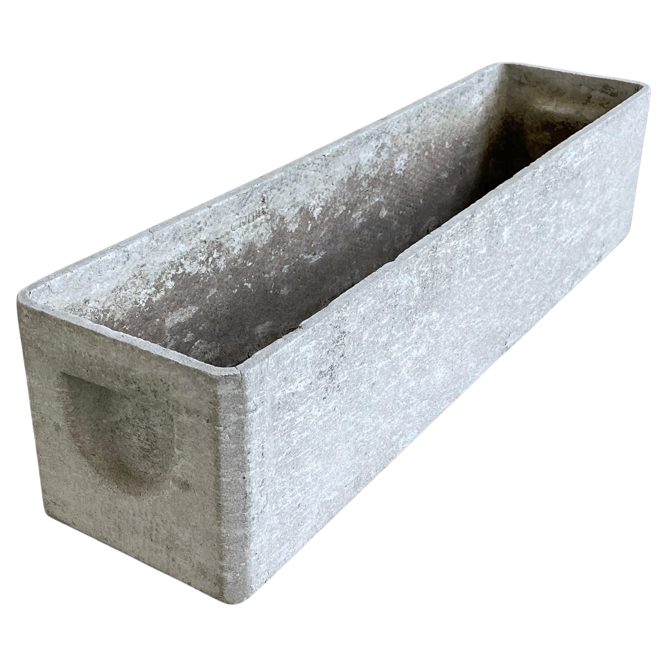 Minimalist concrete planter trough by prominent Swiss designer, Willy Guhl. Made in Switzerland ca. 1950 - 1960. Produced by Eternit AG, Switzerland. Solid concrete with drainage holes. With original recessed handles.
In original condition with