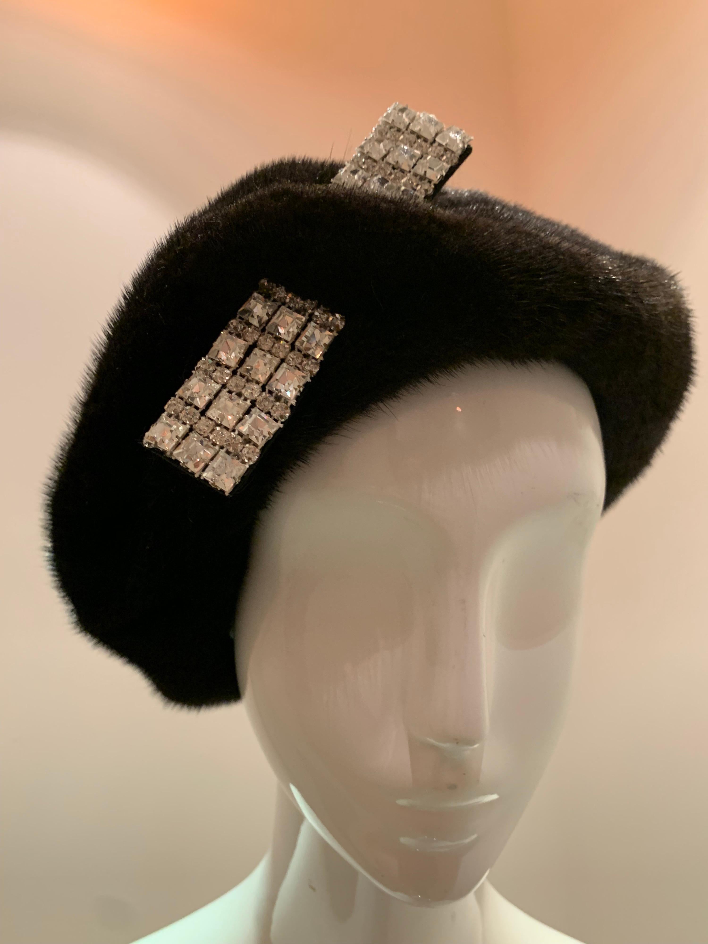 A 1950s mink beret with a stunning rhinestone accent piece that appears to pierce the crown.  