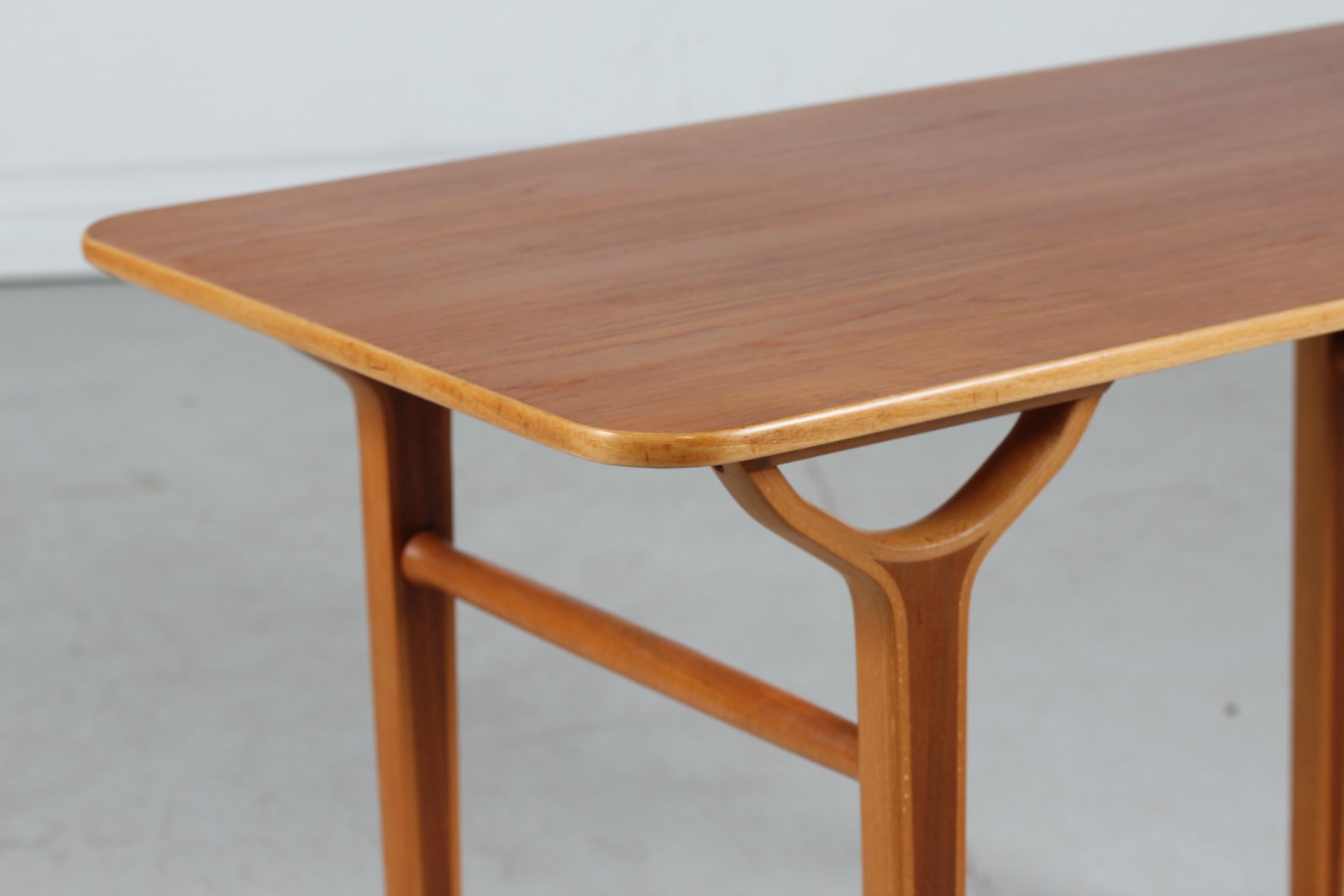 Vintage AX coffee table by the Danish architects Peter Hvidt & Orla Mølgaard.

The table is made in the 1950s of teak with inlaid beech wood and remains in very nice vintage condition without damage.

Manufactured by Fritz Hansen A/S.

