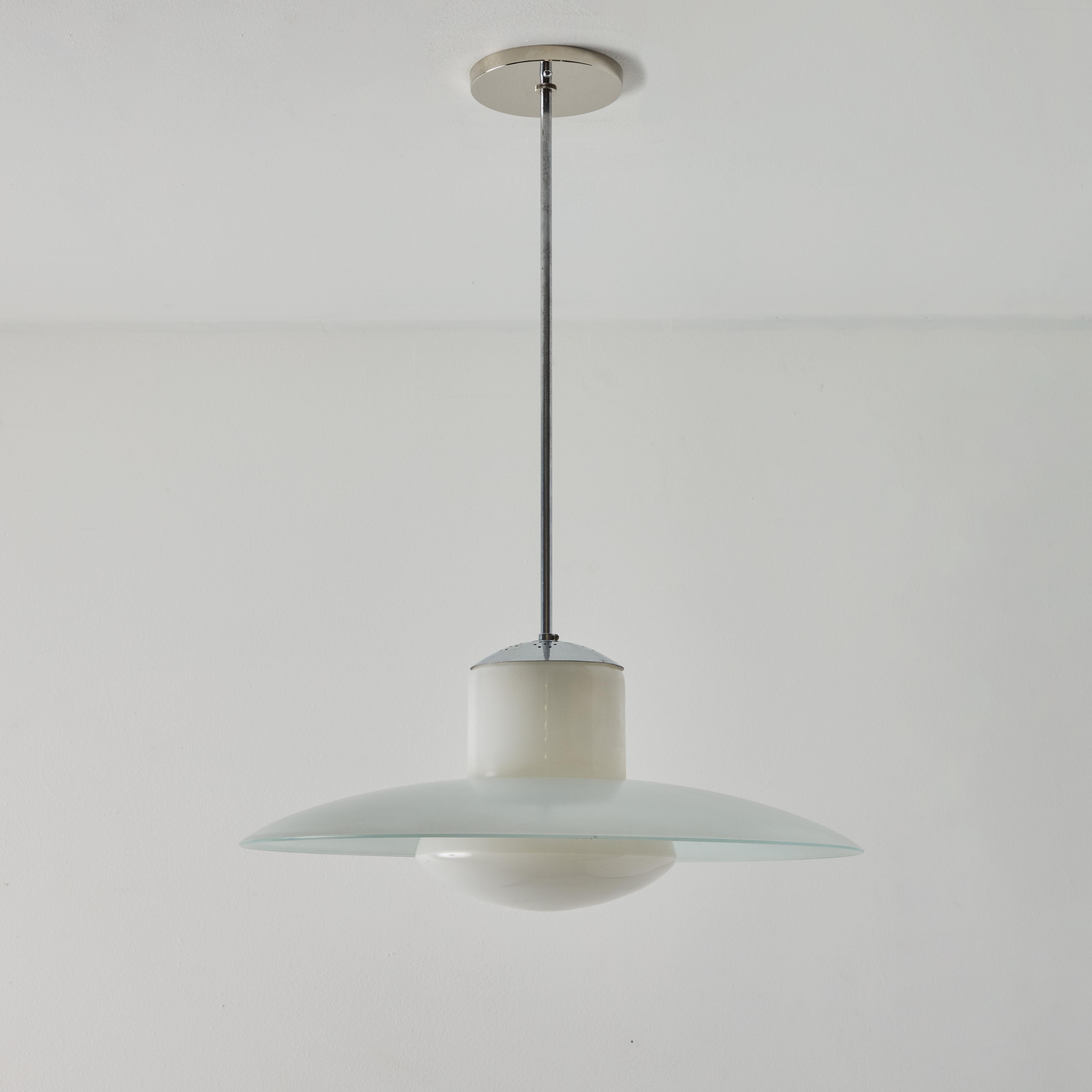 1950s Model #913/3522-55 Glass & Metal Ceiling Lamp By Wolfgang Tümpel for Doria. Executed completely in sculptural opaline glass. A highly functional pendant light of attractive scale and incomparable refinement, characteristic of the midcentury