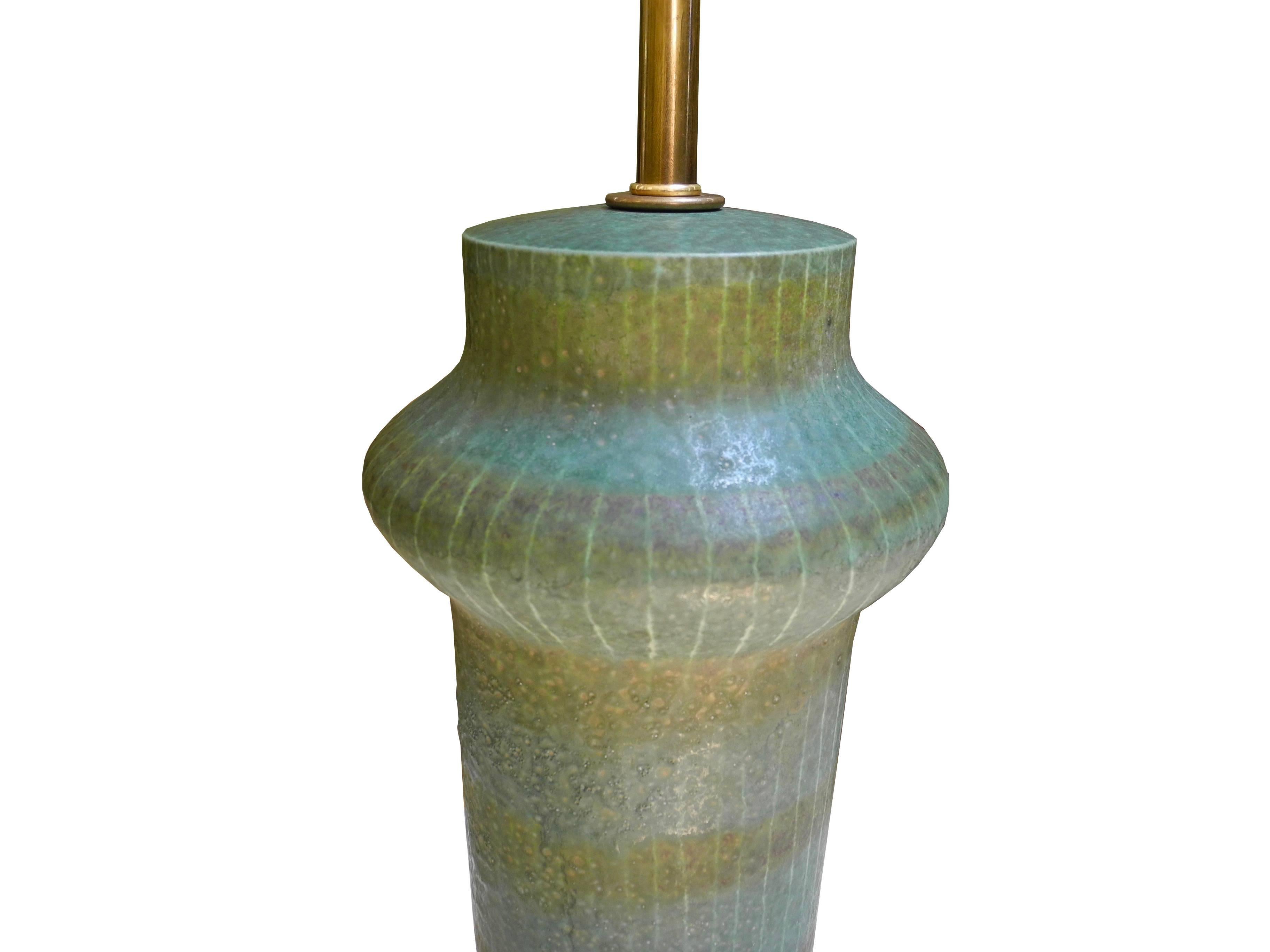 This 1950s ceramic lamp is stamped Made in Italy yet has a beautiful glaze and shape that is reminiscent of Japanese or Danish midcentury pottery. Top of the ceramic measures 14.25 inches.