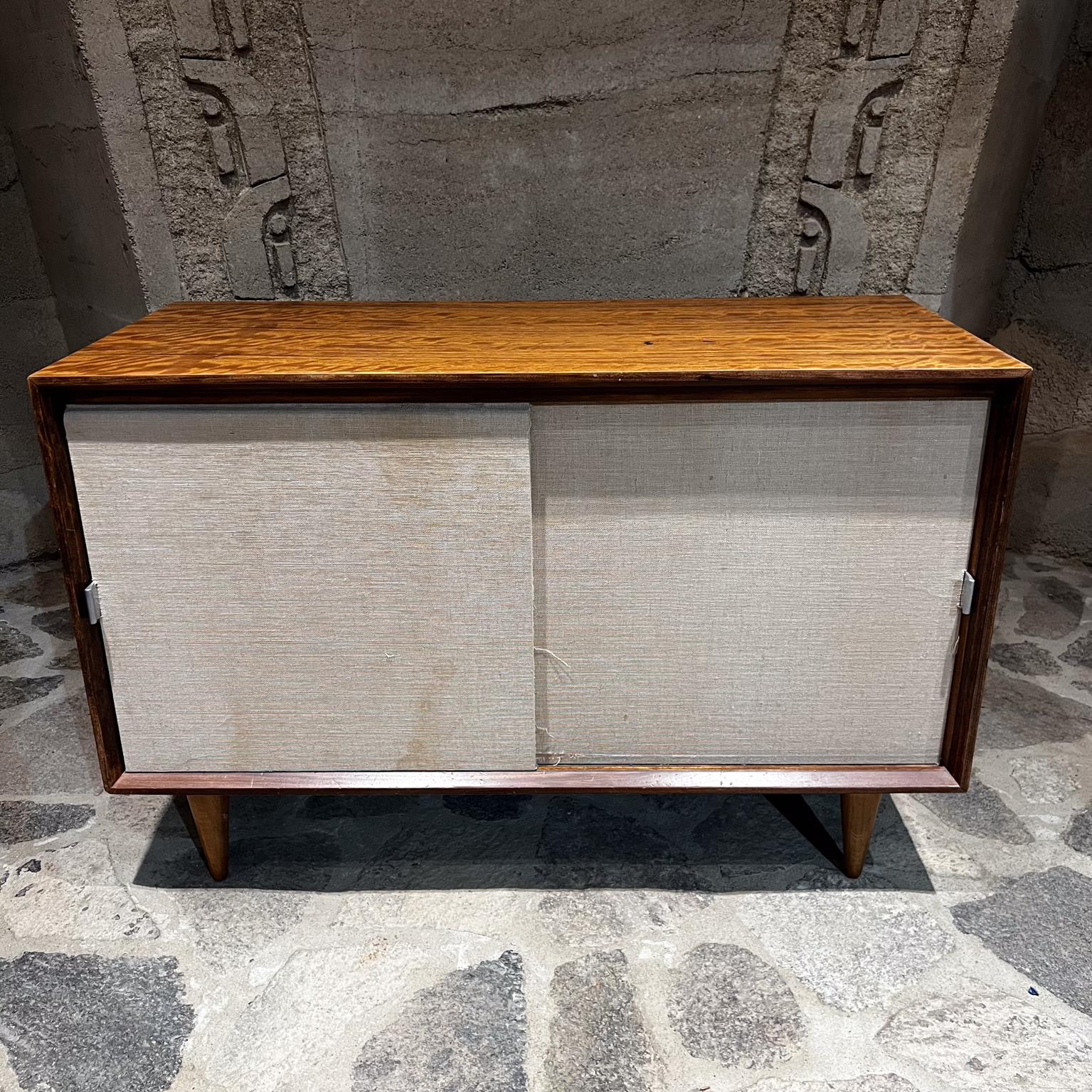 AMBIANIC presents
1950s Modern Edward Wormley for Dunbar Sliding Door Cabinet
Interior shelf
Unsigned attribution Edward Wormley
42 w x 19 d x 27.75 h
Preowned original vintage condition. Some stains present panel doors.
Refer to photos.