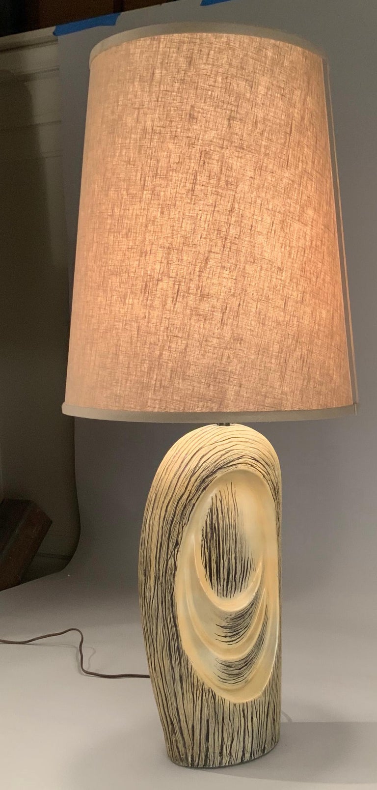 A very nice modern 1950's glazed ceramic lamp, made to look like the trunk of a tree - faux bois! beautiful design, color, and scale. excellent condition, along with a new shade in sand colored linen.