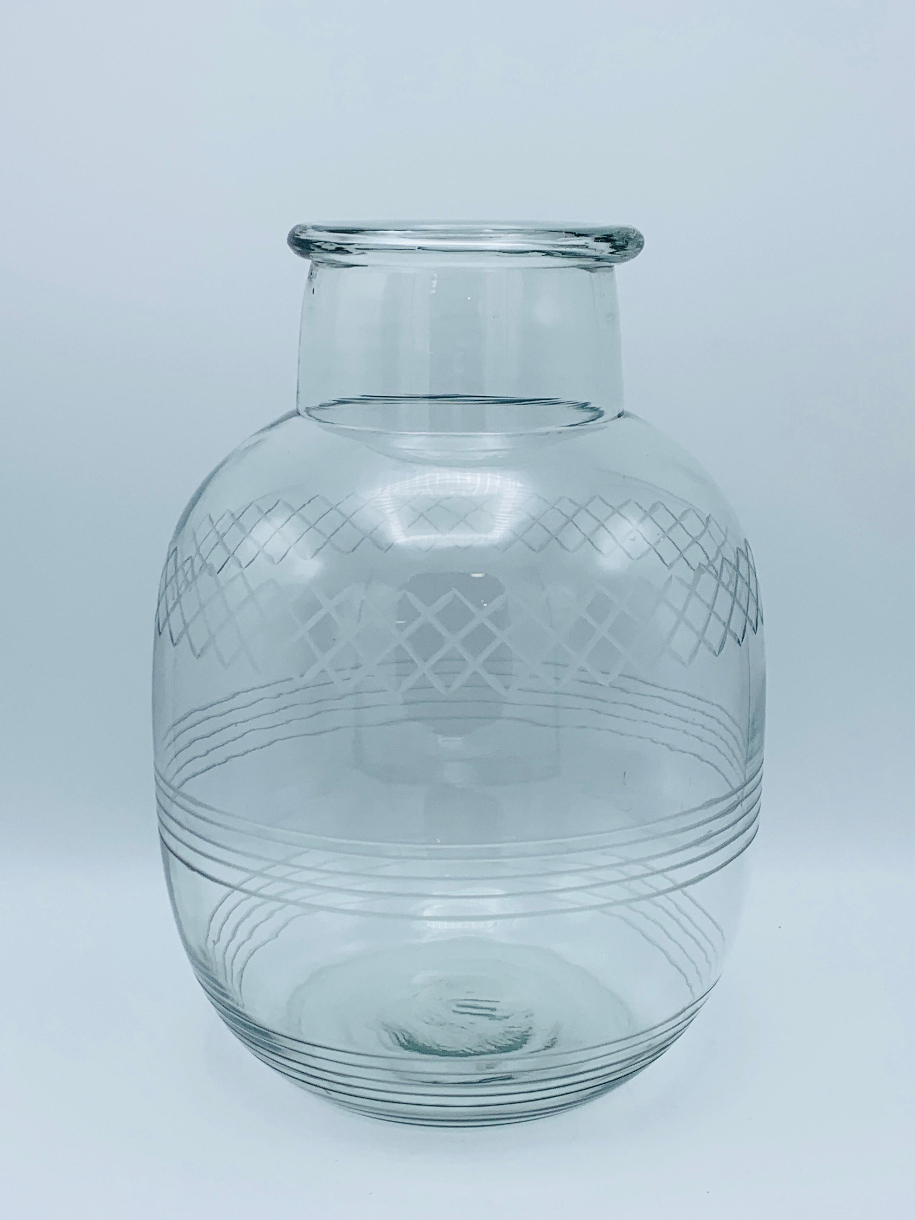 Listed is a stunning, pair of oversized, 1950s etched glass vases. The pair stand 12.88