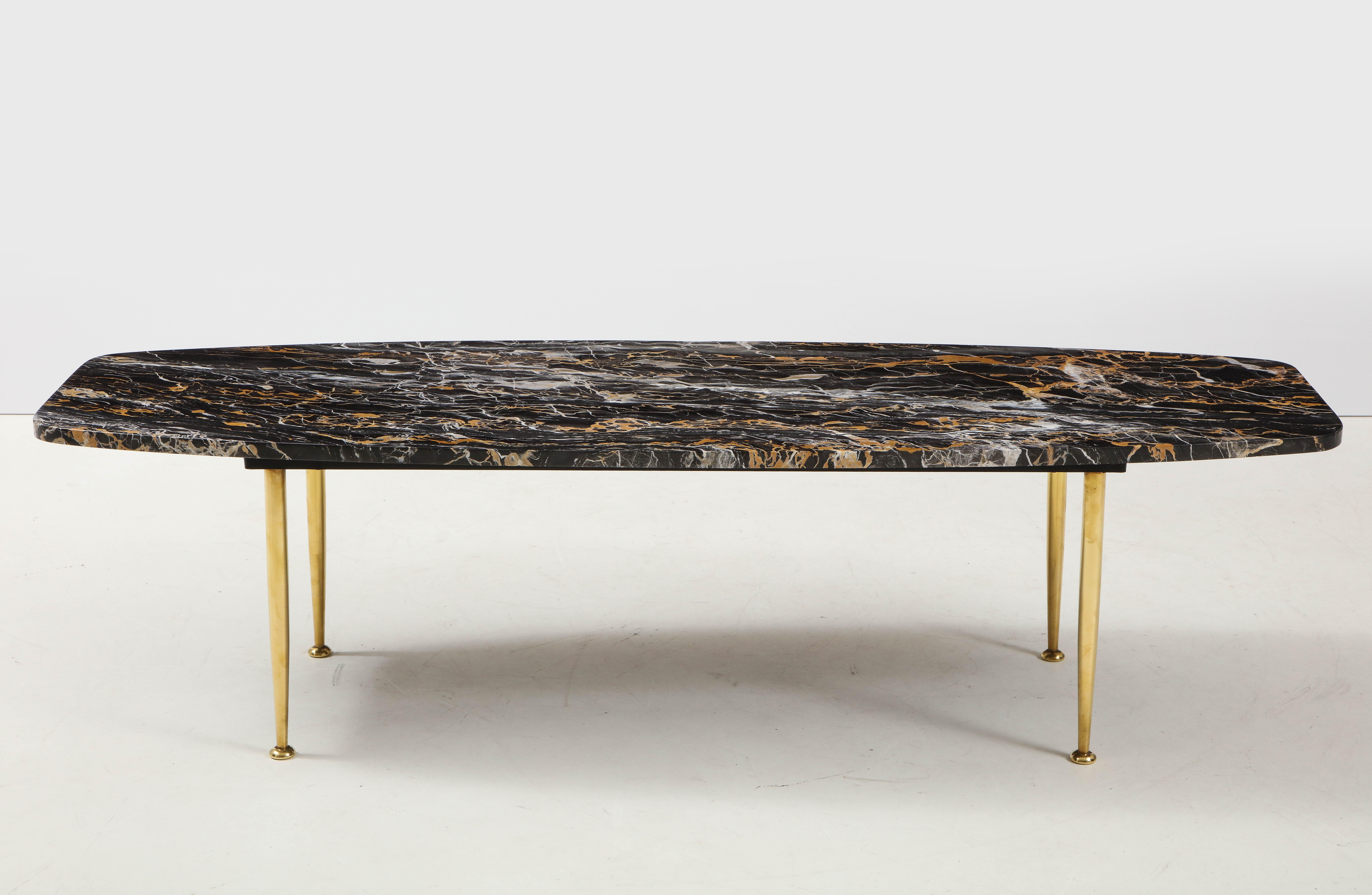 Stunning 1950s Mid-Century Modern exotic marble top with tapered brass legs Italian coffee table. In vintage condition the legs have been lightly hand polished.