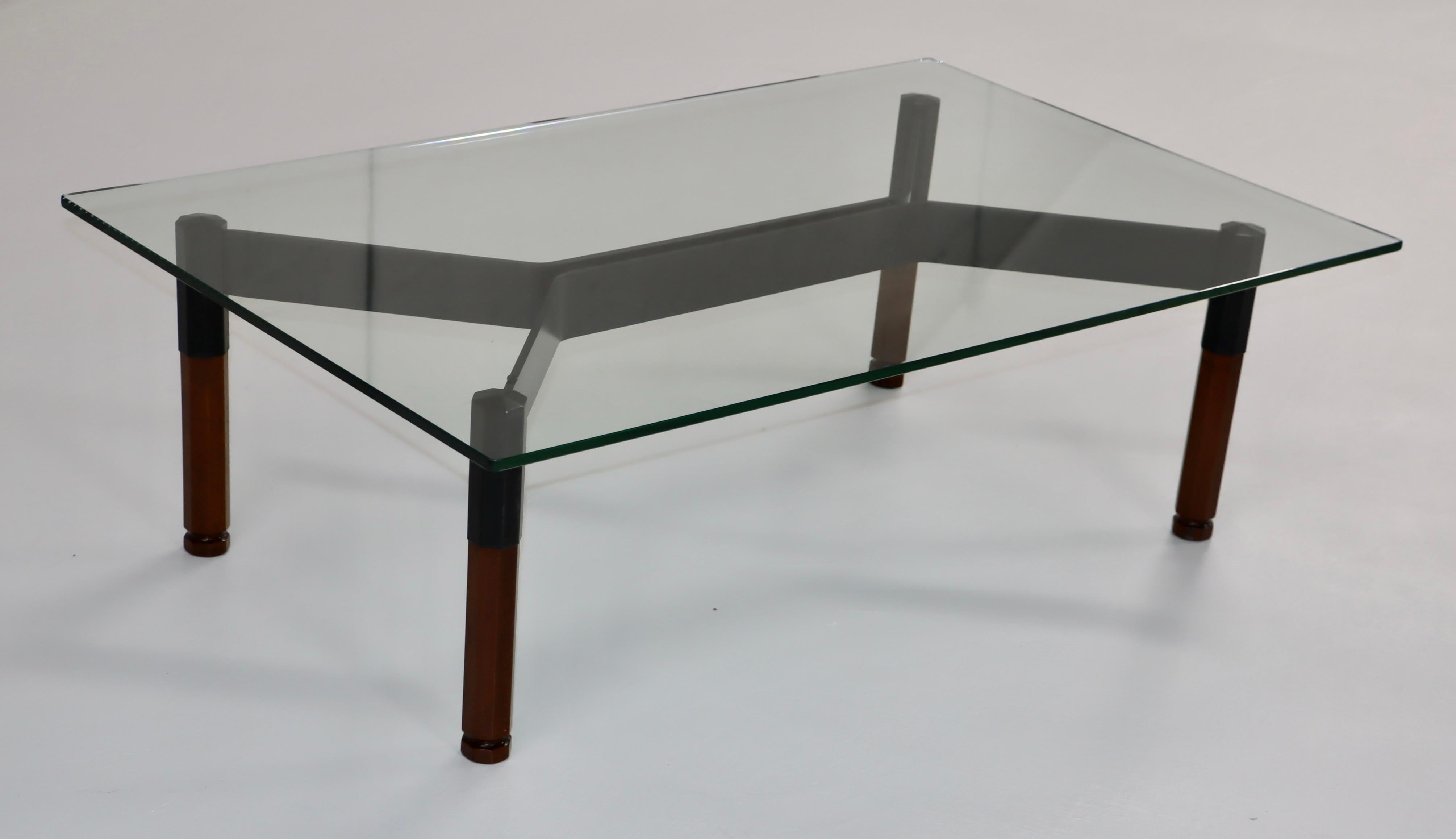 1950's solid iron and walnut base with glass top Italian coffee table by Forma Nova, fully restored with minor wear and patina due to age and use. 