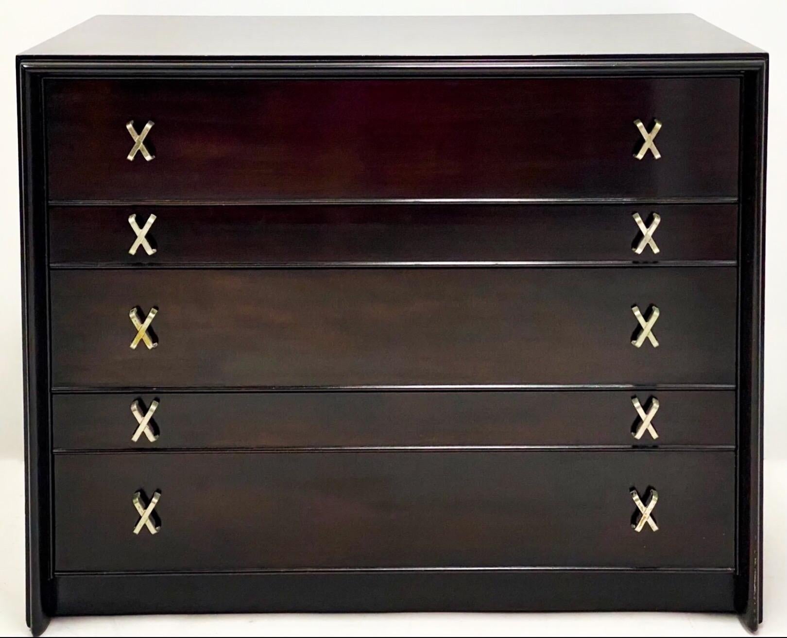 Love this! This is an ebonized walnut chest with plated brass hardware designed by Paul Frankl for John Stuart. It is in very good condition and is marked.