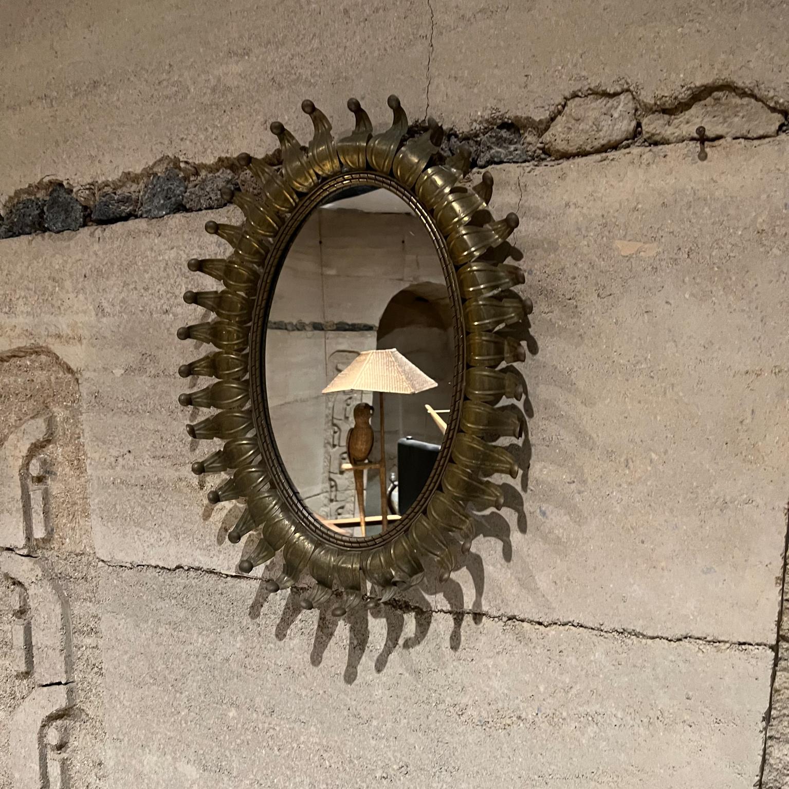 Hollywood Regency 1950s Modern Regency Radiant Oval Sunburst Wall Mirror in Patinated Brass