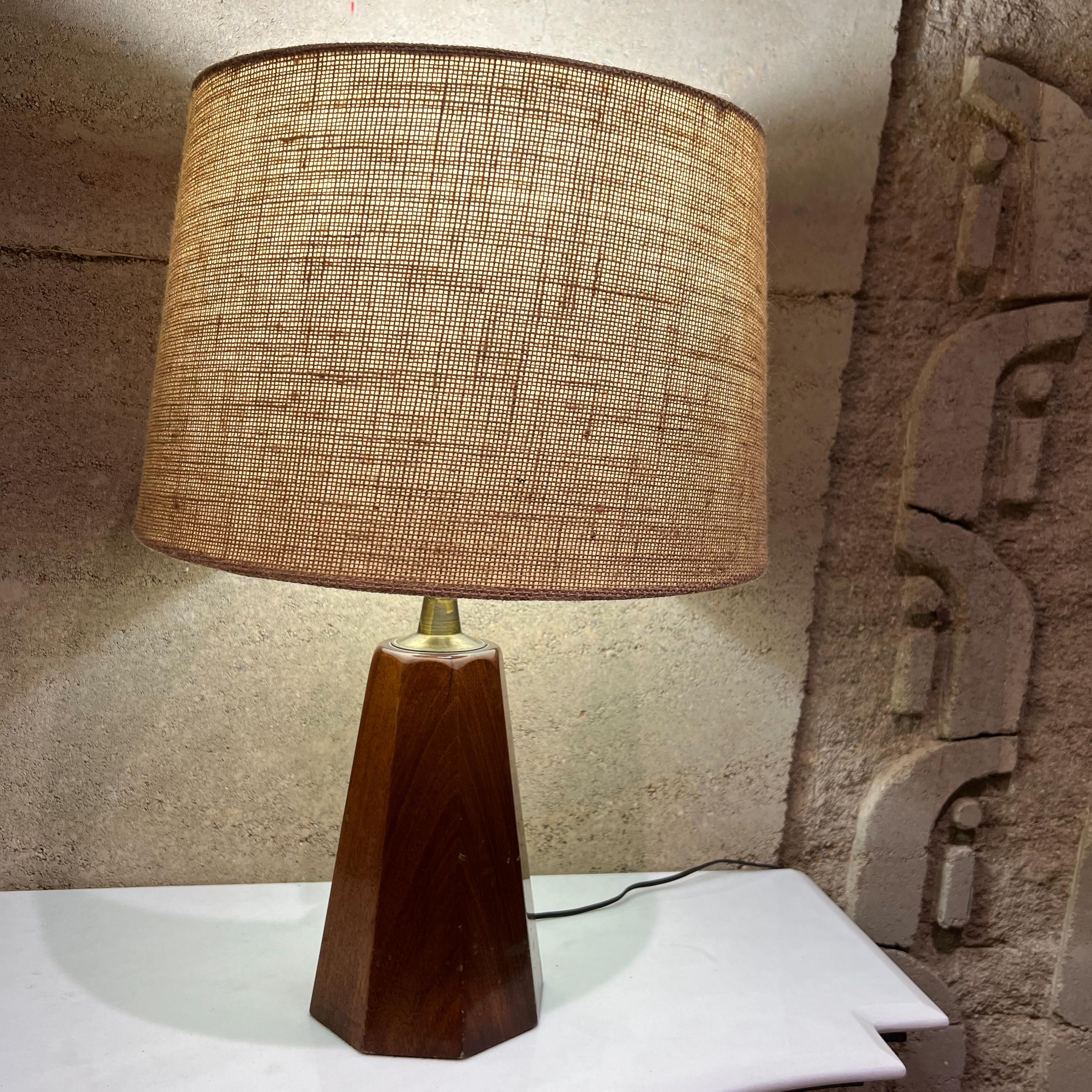 1950s modern table lamps in mahogany & brass by Angelita Mexico 
Pair of sculptural cedar wood or mahogany wood and brass table lamps.
Measures: 15.25 tall x 5.25 diameter
Retains stamp label from the maker.
No shade. Preowned vintage unrestored